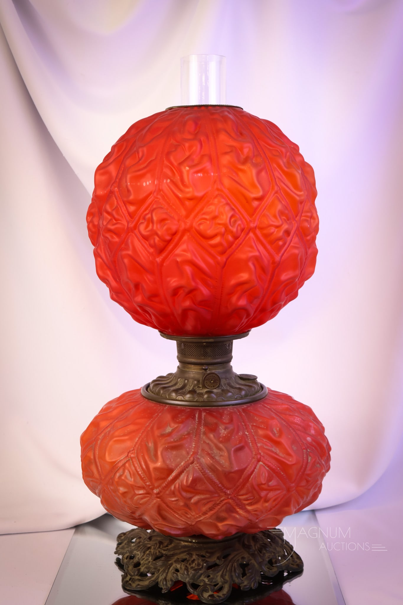 Victorian Red Satin Pigeon Blood Imperial Drape Gone with the Wind Parlor Oil Lamp: What a great lamp this one is! This Victorian red satin pigeon blood Gone with the Wind parlor oil lamp measures 22" tall and 12" wide. This lamp is in the Imperial Drape pattern. The lamp remains oil