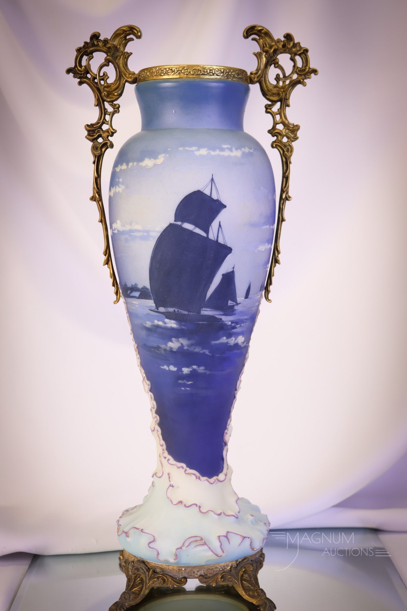 Monumental 18 1/2" Wave Crest Cobalt Sailboat Ormolu Vase: A monumental and museum find in Victorian Wave Crest. This piece is unsigned. The ornate vase is decorated in rich cobalt coloring depicting a sailboat scene. The vase is further enhanced by ornate or