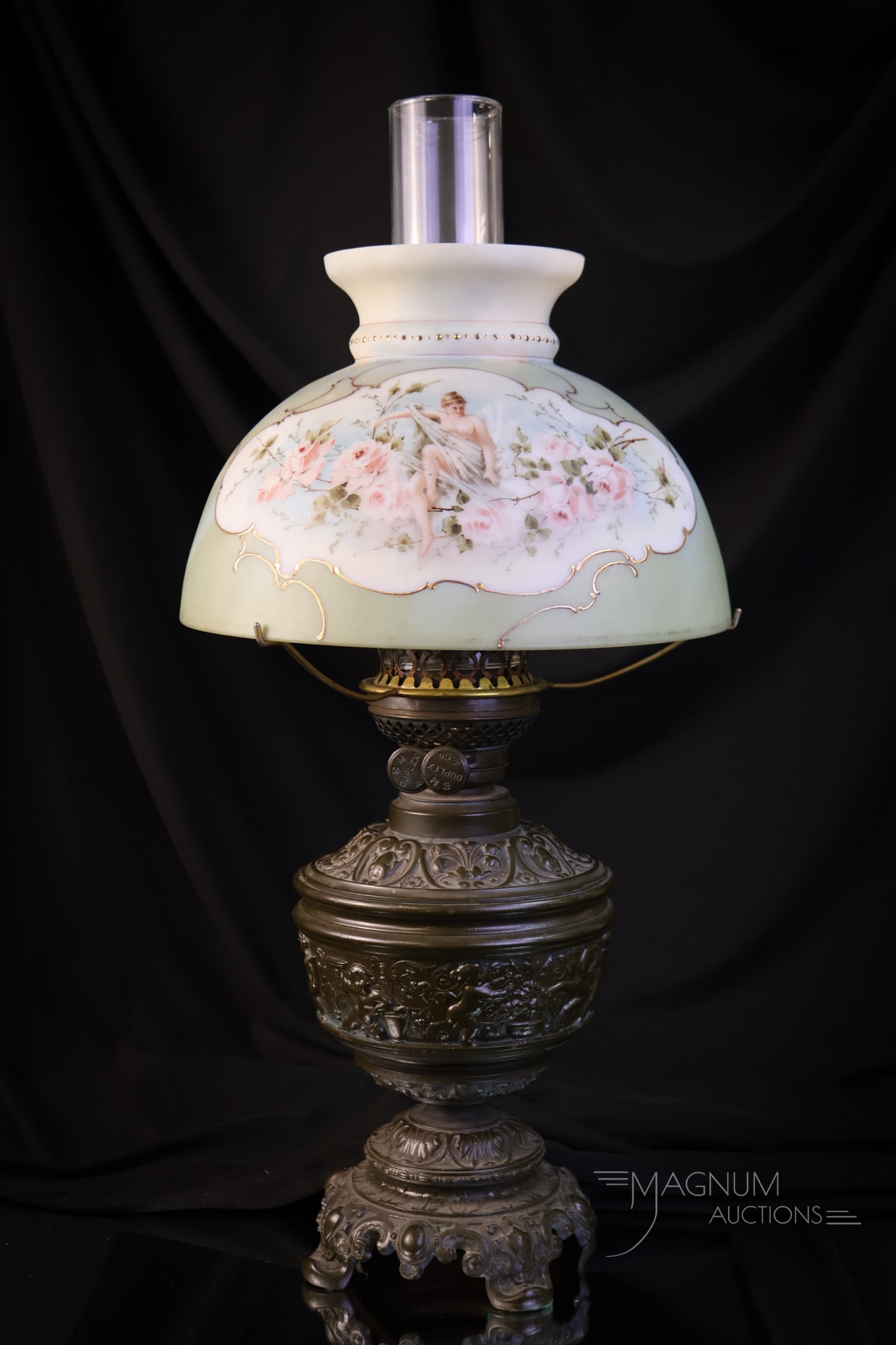Wave Crest Victorian Portrait Nude & Roses Oil Lamp: A wonderful find in Victorian Wave Crest. This lamp features a shade with moss green coloring and a portrait nude on one side and roses on the reverse. It is further enhanced by gilt scrolling. The oi