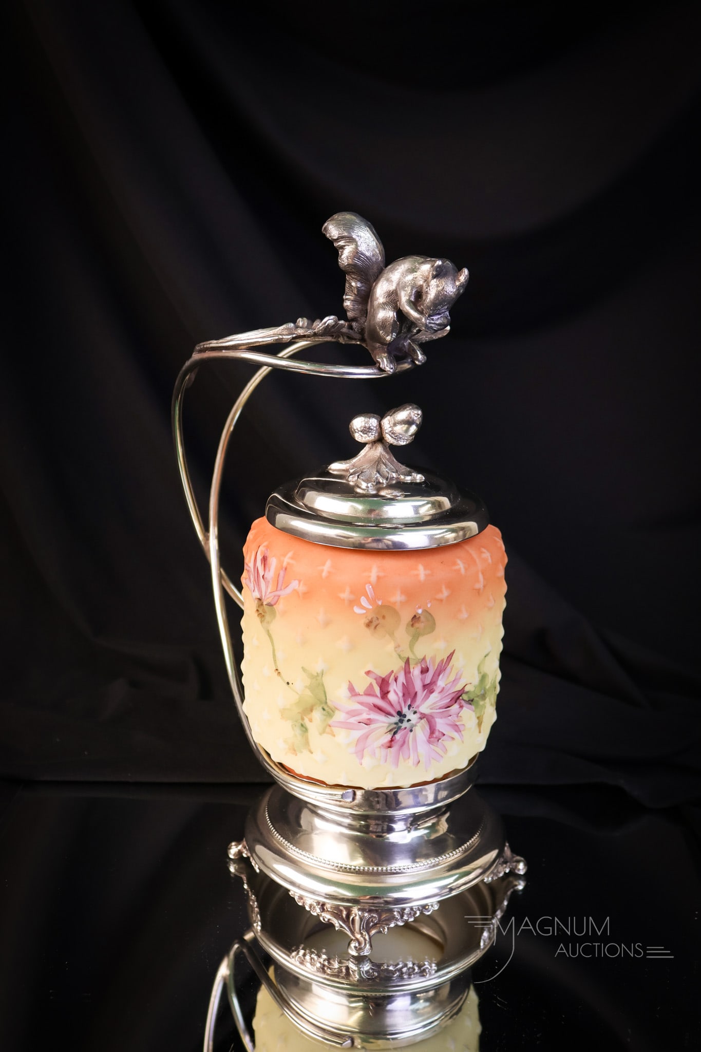 Apollo Silverplate Victorian Mt. Washington Crown Milano Pickle Castor: A beautiful find in a Victorian pickle castor. This piece features a signed Apoillo silverplate holder with a figural squirrel on th the top of the handle. The pickle jar is a Mt. Washington glass