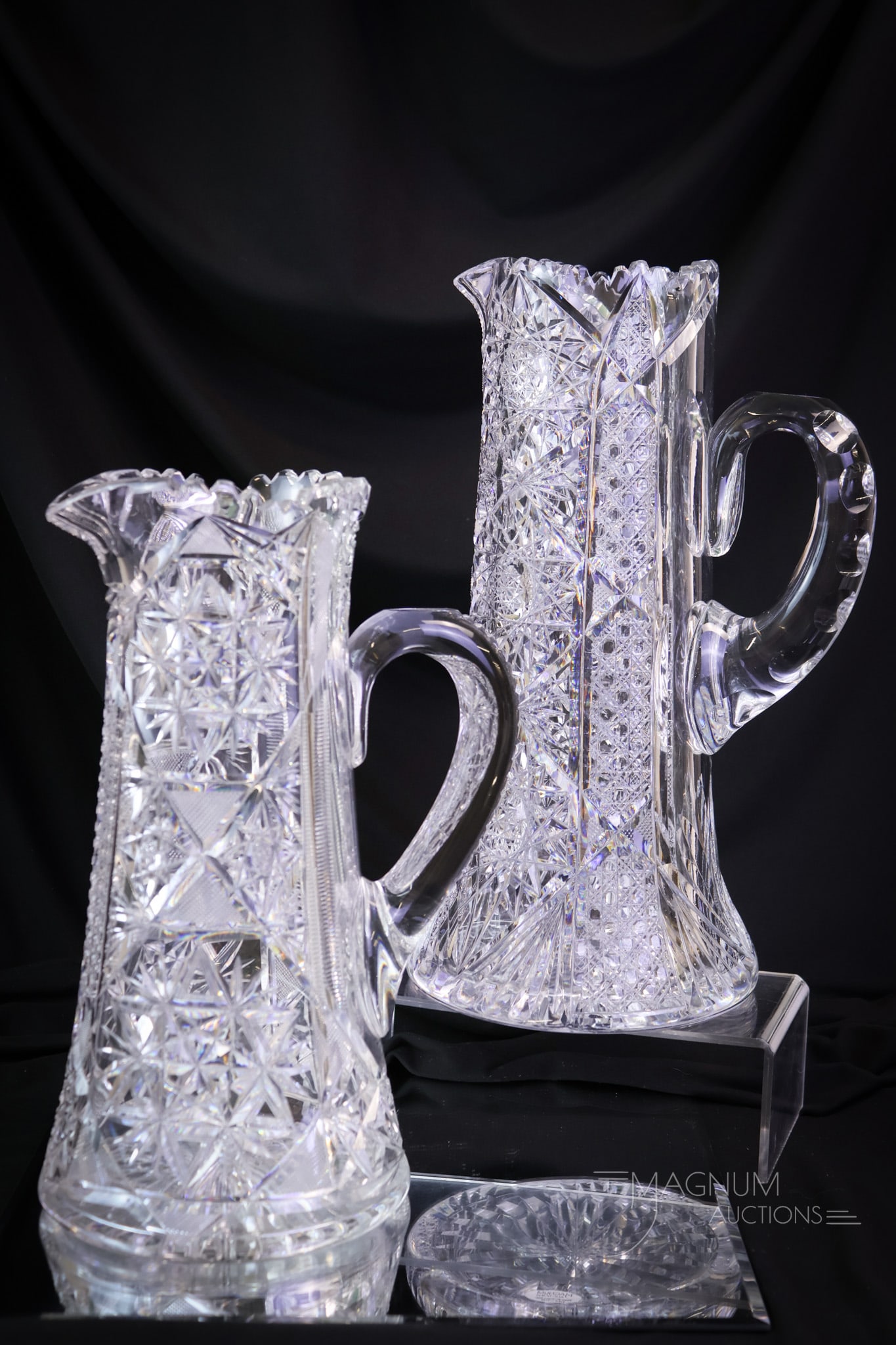 2 pc Lot ABP American Brilliant Period Cut Glass Tankard Pitchers: Two fine examples of American Brilliant Period cut glass tankard pitchers. One is in the Hobstar & Cane pattern. One is in the Hobstar and File pattern. The other is a Hobstar and File pattern. The