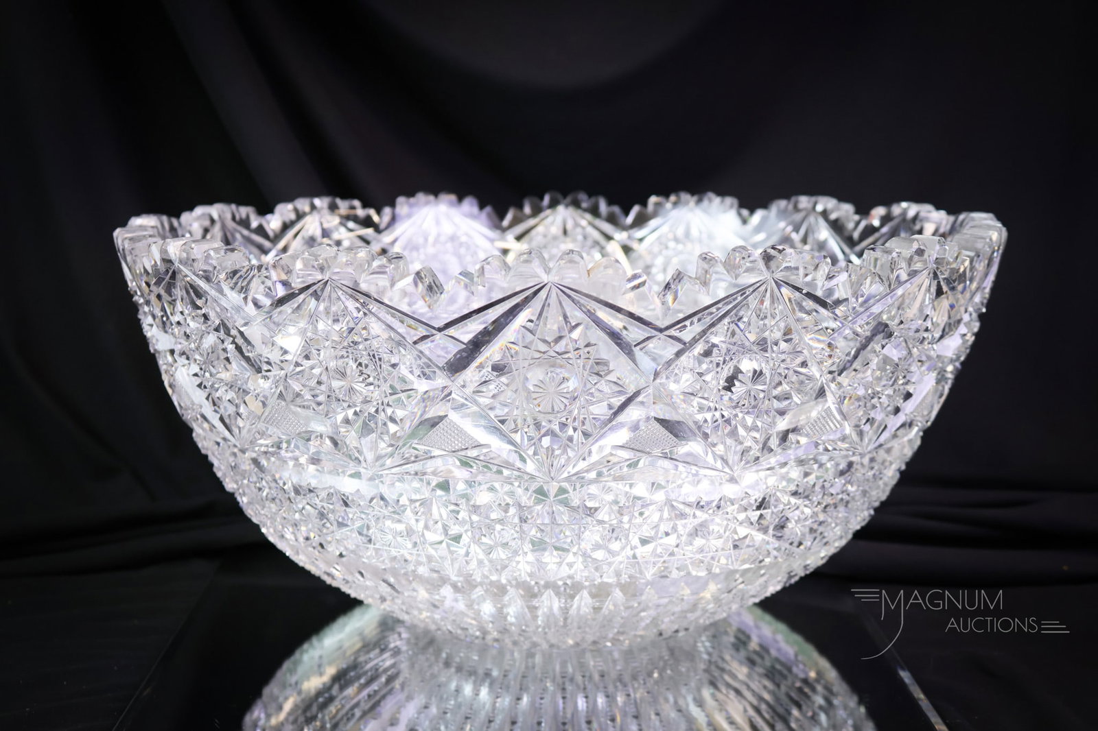 ABP American Brilliant Period Cut Glass Punch Bowl: A wonderful find in an American Brilliant Period cut glass punch bowl. This super example features a Chain of Hobstars and a chain of Russian with a notched rim prism cutting. The base features a 32-p