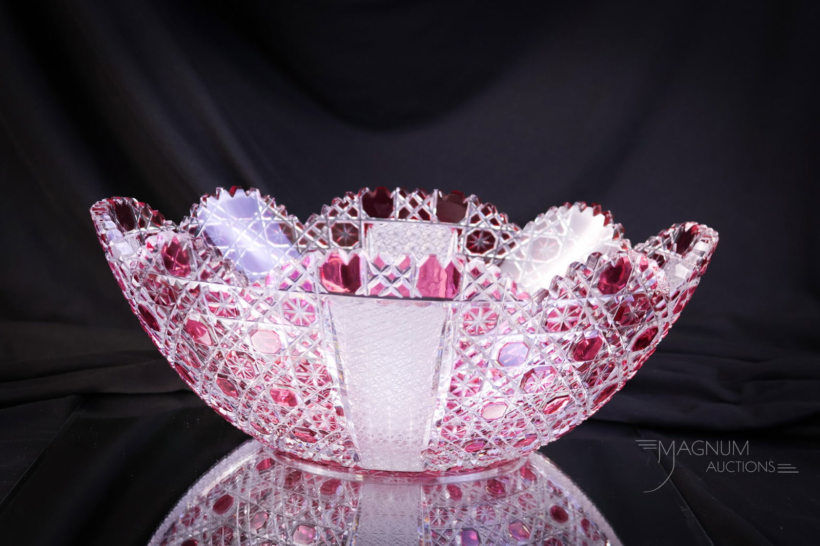 Cranberry Cut to Clear Oval Bowl: A beautiful piece of cranberry cut to clear in the form of an oval bowl. The bowl has exquisite coloring and cutting. The piece measures 4 1/2" tall and 12" wide. SHIPPING NOTICE: If you choose not to