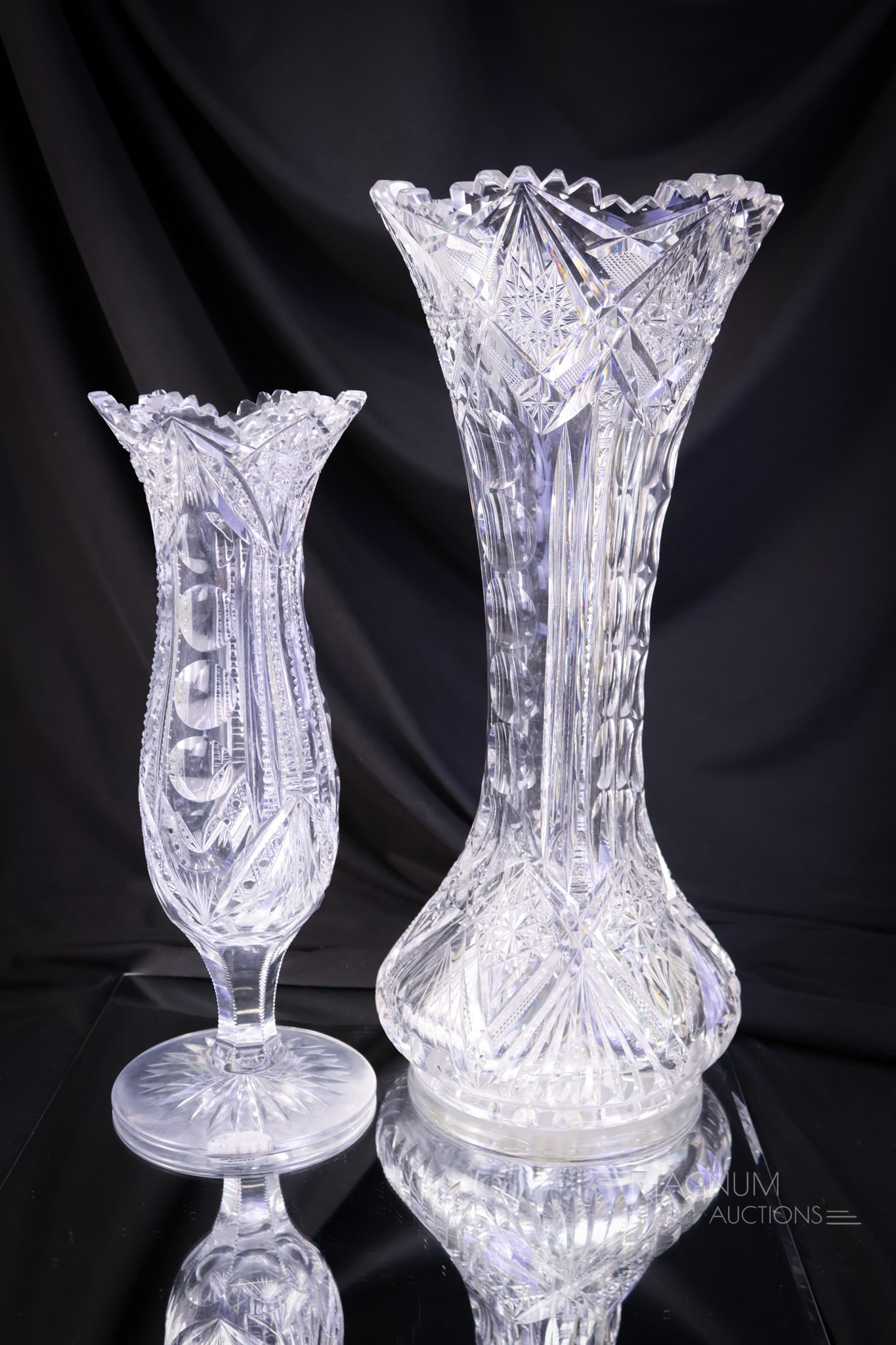 2 c Lot ABP American Brilliant Period Cut Glass Clark & More: A two piece lot of American Brilliant Period cut glass vases. The first is in the Iris pattern by Clark. This one exhibits a minor tooth chip. The second is a pedestal tulip vase cut with columns of p