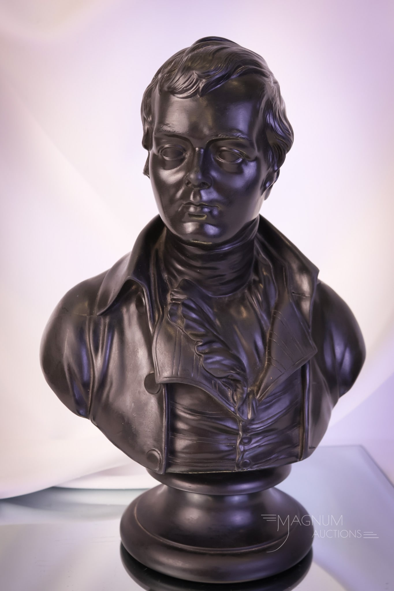 Wedgwood 13 1/2" Black Basalt Bust of Robert Burns: A great find in Wedgwood. This is a black basalt bust of Robert Burns. This piece is marked Wedgwood on the back as well as the underside. It is also marked "Burns" and "E.W. Wyon F." Bolted to a circ