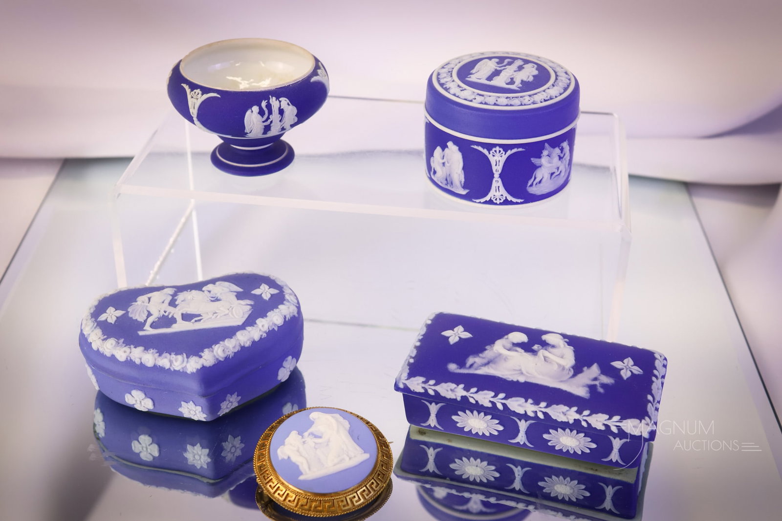 5 pc Lot Wedgwood Blue Jasperware: Five delights sure to bring a smile to your face. This lot includes three small covered boxes, an open salt, and a brooch. The tallest measures 1 3/4". SHIPPING NOTICE: If you choose not to utilize th