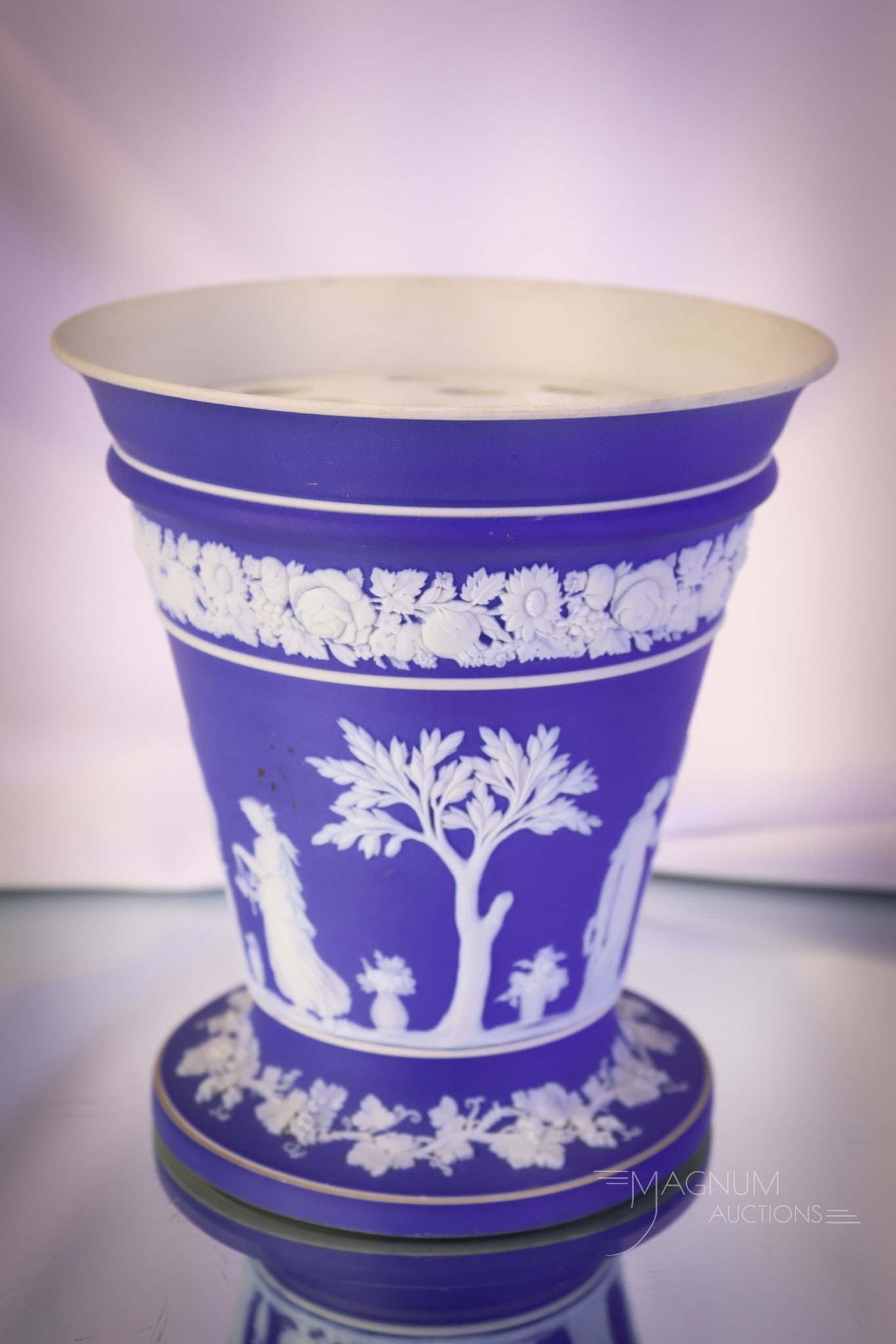 Marked Wedgwood Blue Jasperware Flower Vase: Another beautiful piece of antique, marked Wedgwood blue Jasperware. This is a flower vase complete with the flower frog disk insert. The vase measures 7" tall and 6 1/4" wide. SHIPPING NOTICE: If you