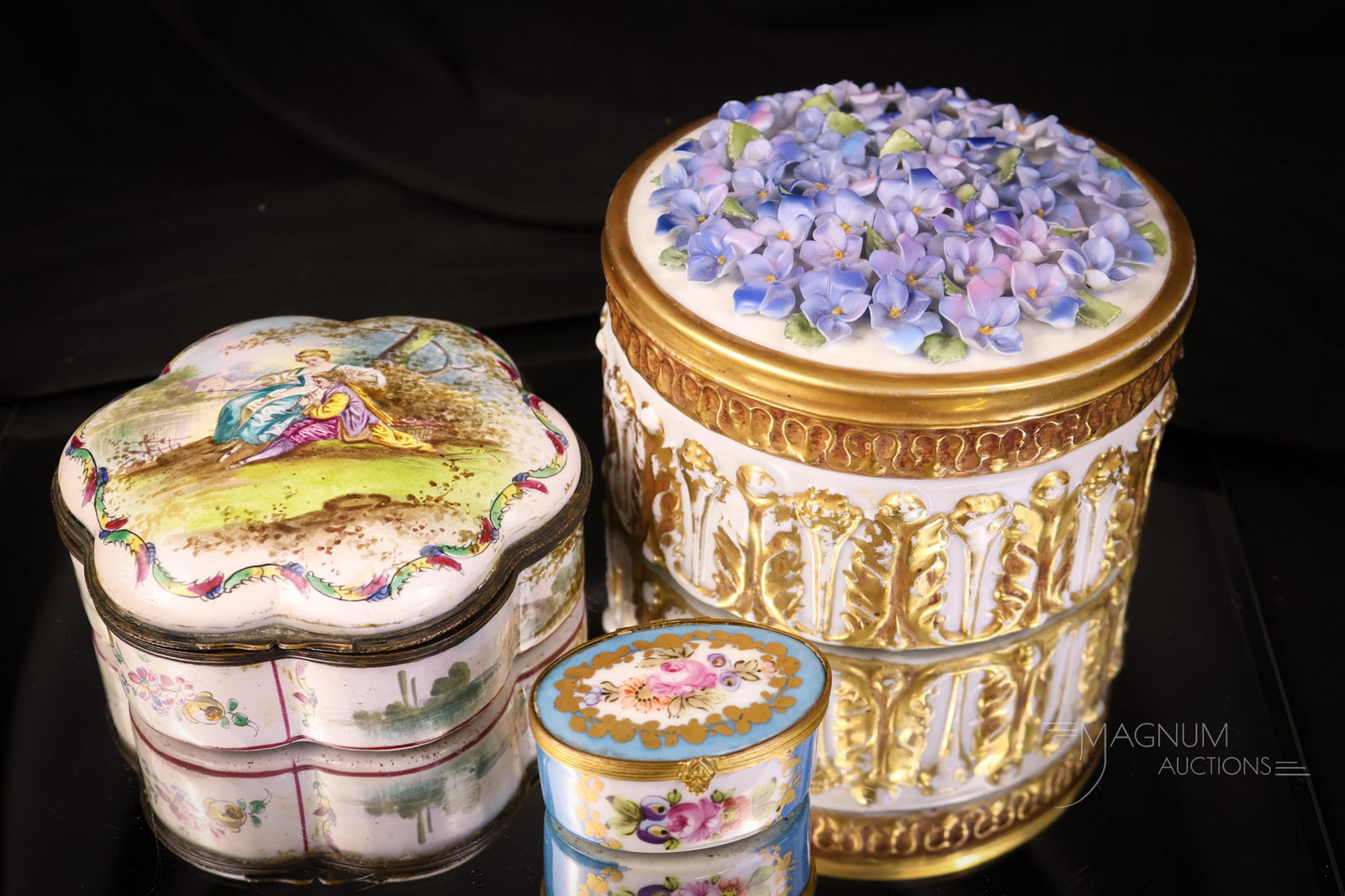 3 pc Lot Antique Porcelain Boxes Sevres Capodimonte & More: Three superb finds in antique porcelain boxes. The first is a signed Capodimonte round box with finely applied violet flowers. The second is an unmarked one with a courting couple on the lid. The last