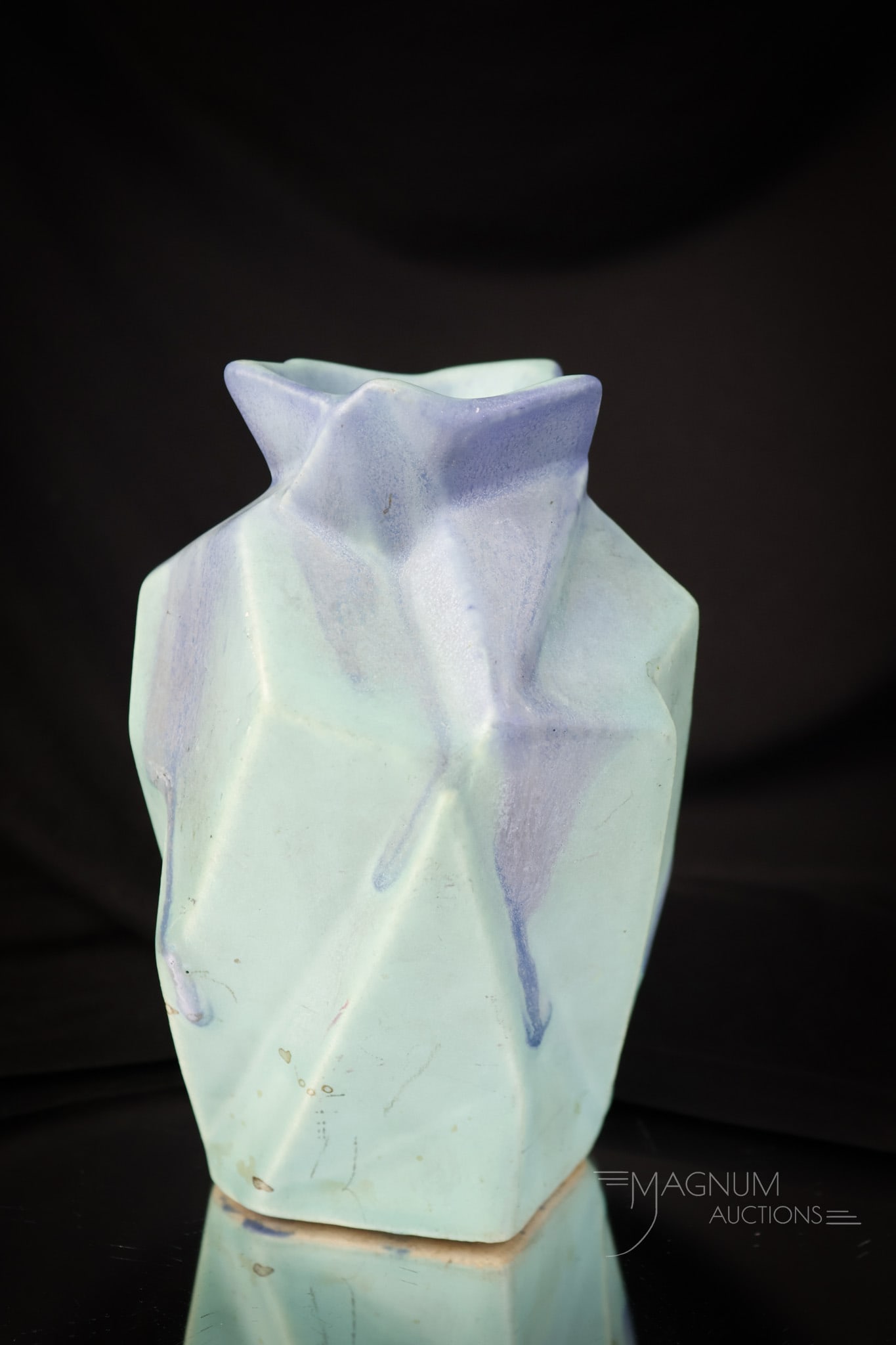 Rare Muncie Pottery Reuben Haley Ruba Rombic Vase: A rare Muncie Pottery Reuben Haley Ruba Rhombic vase. This fine piece is in green and blue matte glaze. The vase measures 5 1/2" tall. SHIPPING NOTICE: If you choose not to utilize the LiveAuctioneers