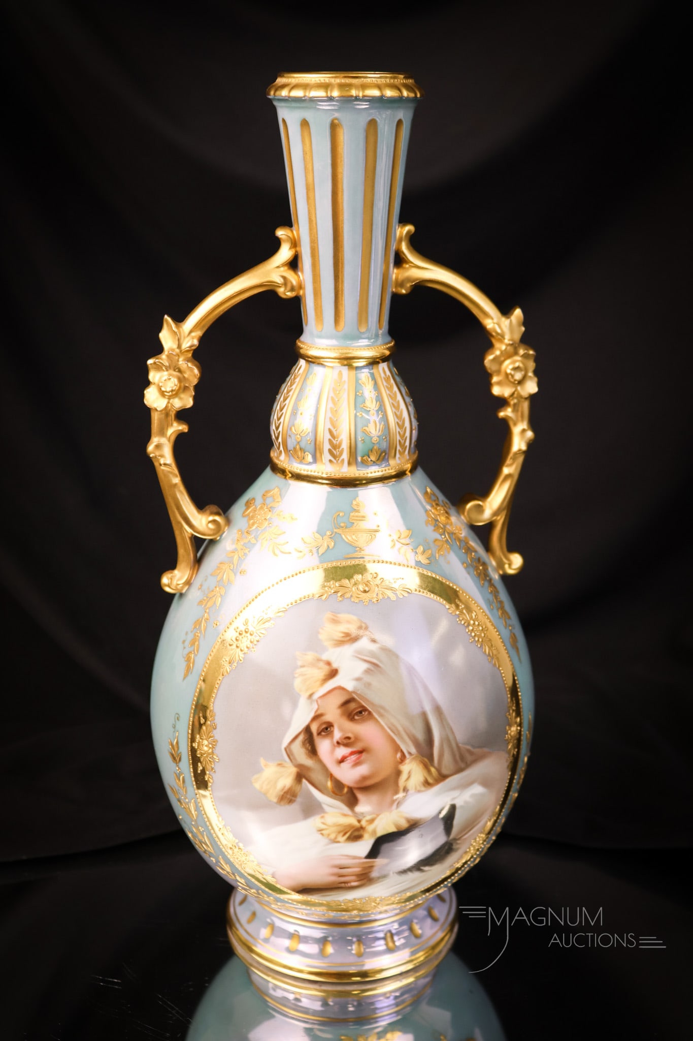 Royal Vienna Germany 12"Artist Signed Portrait Vase: A wonderful artist signed Royal Vienna, Germany portrait vase. This vase measures 12" tall and 5" wide. It is decorated in blue with gold and features a portrait of a beautiful woman with a masquerade
