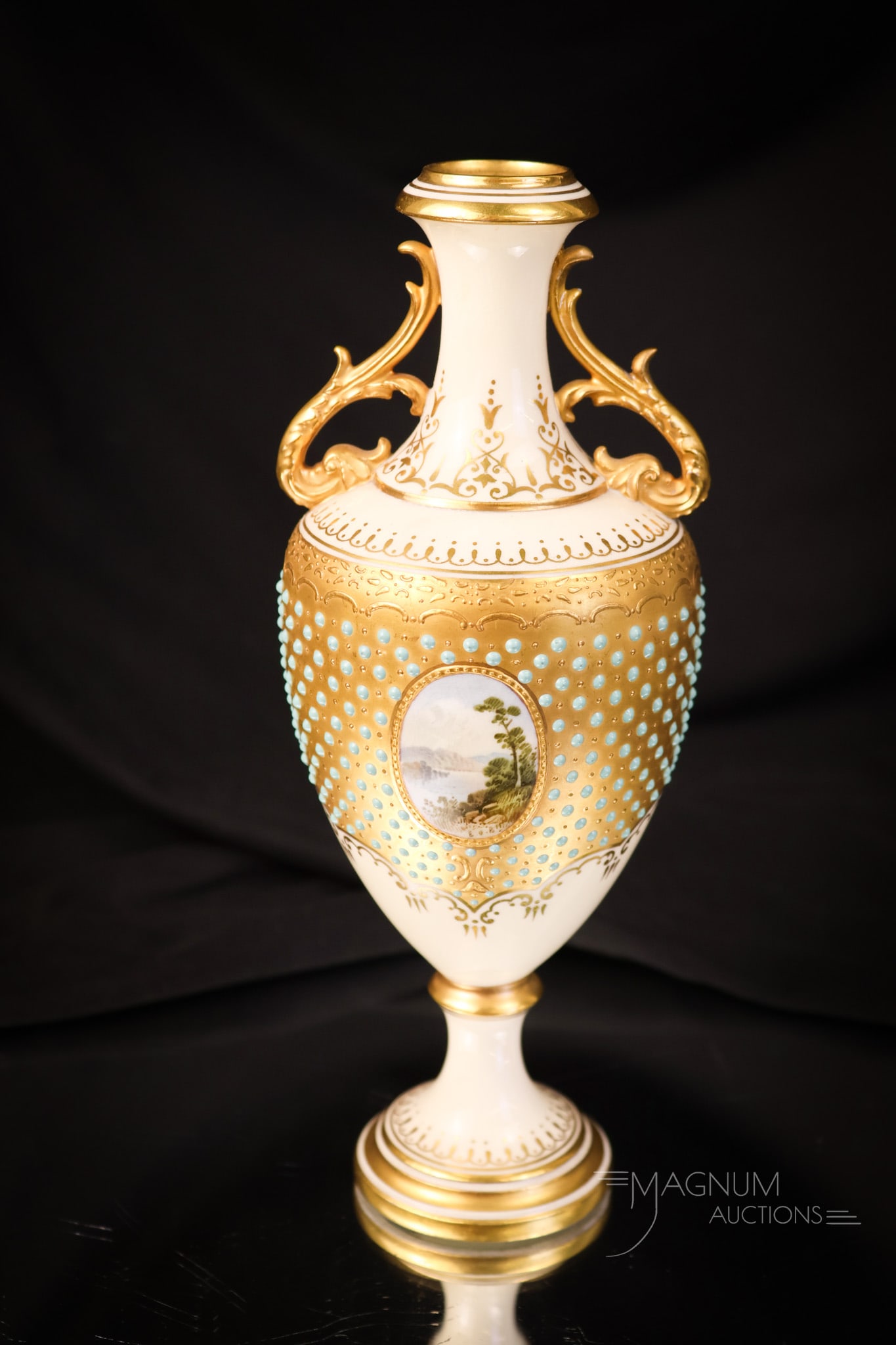 Coalport Ivory Porcelain Double Handle Artist Signed Vase: A wonderful, ivory Coalport artist-signed scenic, decorated vase. This vase features double handles and fine blue dot decoration. The vase measures 7 3/4" tall. SHIPPING NOTICE: If you choose not to u
