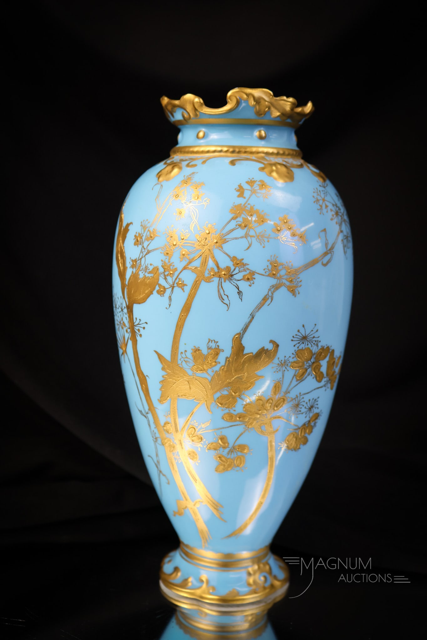 Royal Crown Derby, J.E. Caldwell Blue Gilt Porcelain Vase: A wonderful find in Royal Crown Derby. This J.E. Calwell blue gilt porcelain vase measures 7 3/4" tall and 3 1/2" wide. It features fine gold flowering vines. SHIPPING NOTICE: If you choose not to uti