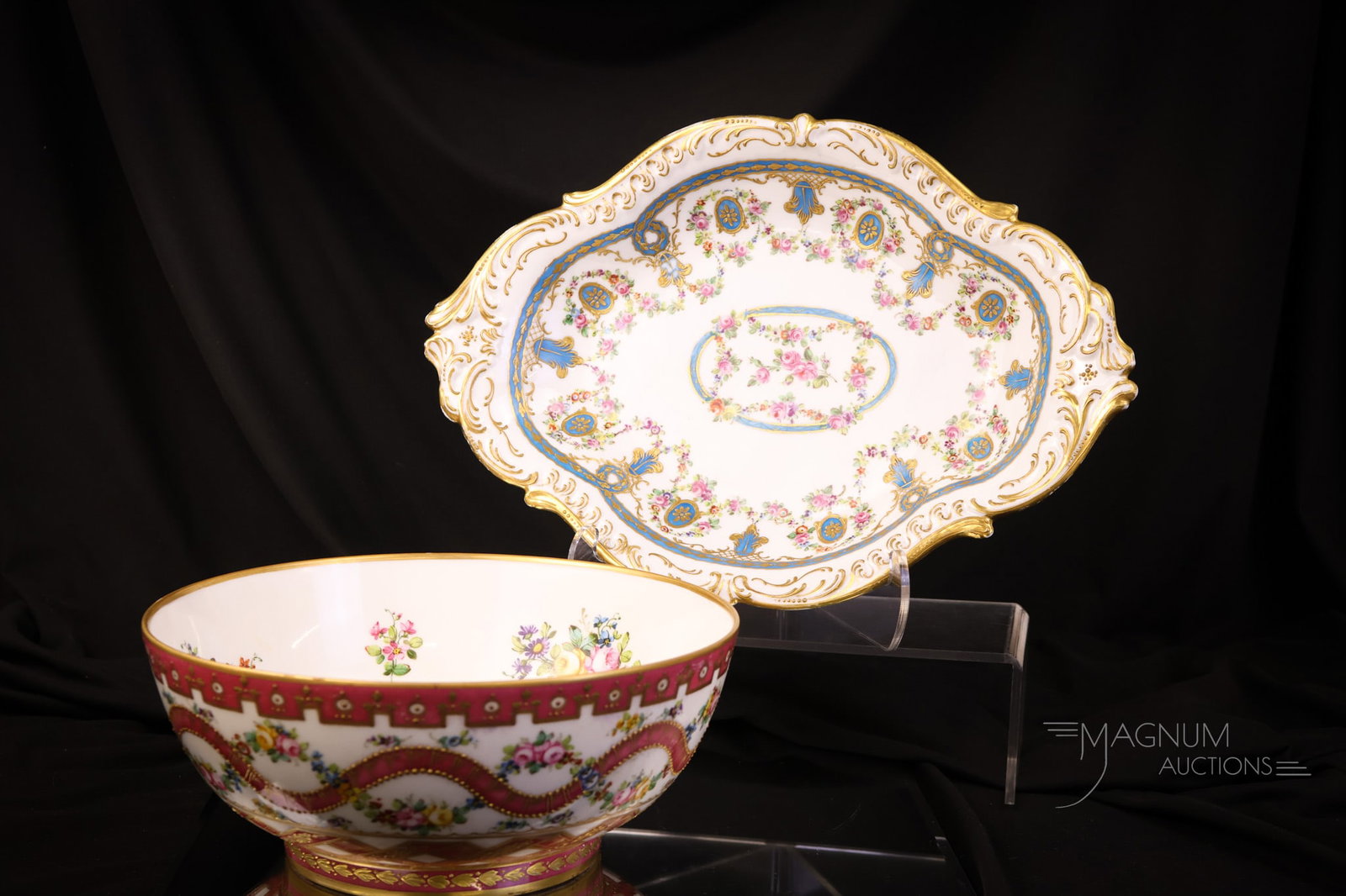 2 pc Lot Sevres Porcelain: Two selections in Sevres porcelain that are sure to please. The first is a large decorated bowl with pink coloring and gold. There are also lots of florals. The second item is an oval tray decorated w