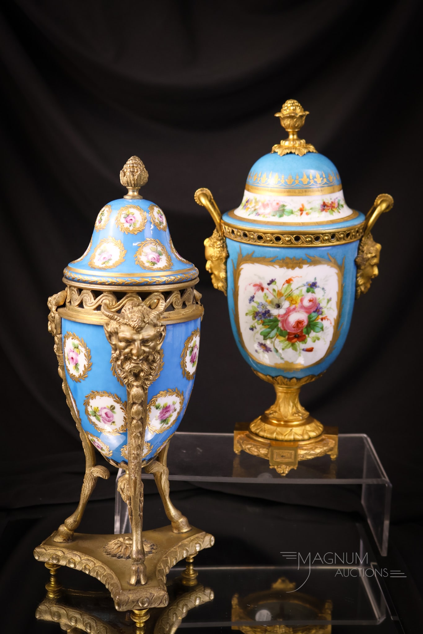 2 pc Lot Sevres Bronze Mounted Mantel Urns: Two wonderful finds in Sevres Bronze-mounted mantel urns. Both are decorated in blue with gold. The tallest measures 12". SHIPPING NOTICE: If you choose not to utilize the LiveAuctioneers LiveShip pro
