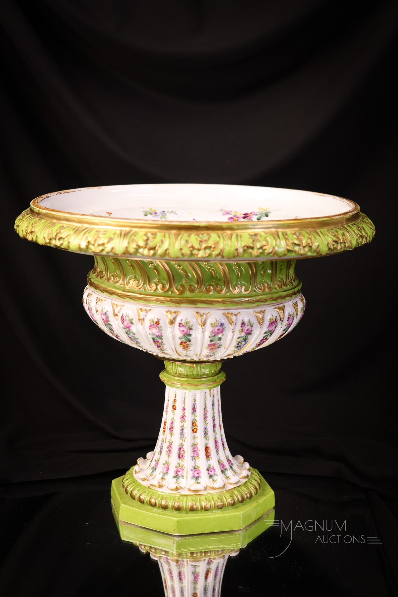 Sevres Bolted large Open Porcelain Compote: A stunning piece of Sevres porcelain in the form of an open compote. This piece is decorated with rows of vertical roses on a lime green ground. A lot of gold trim. The interior is decorated with a fl