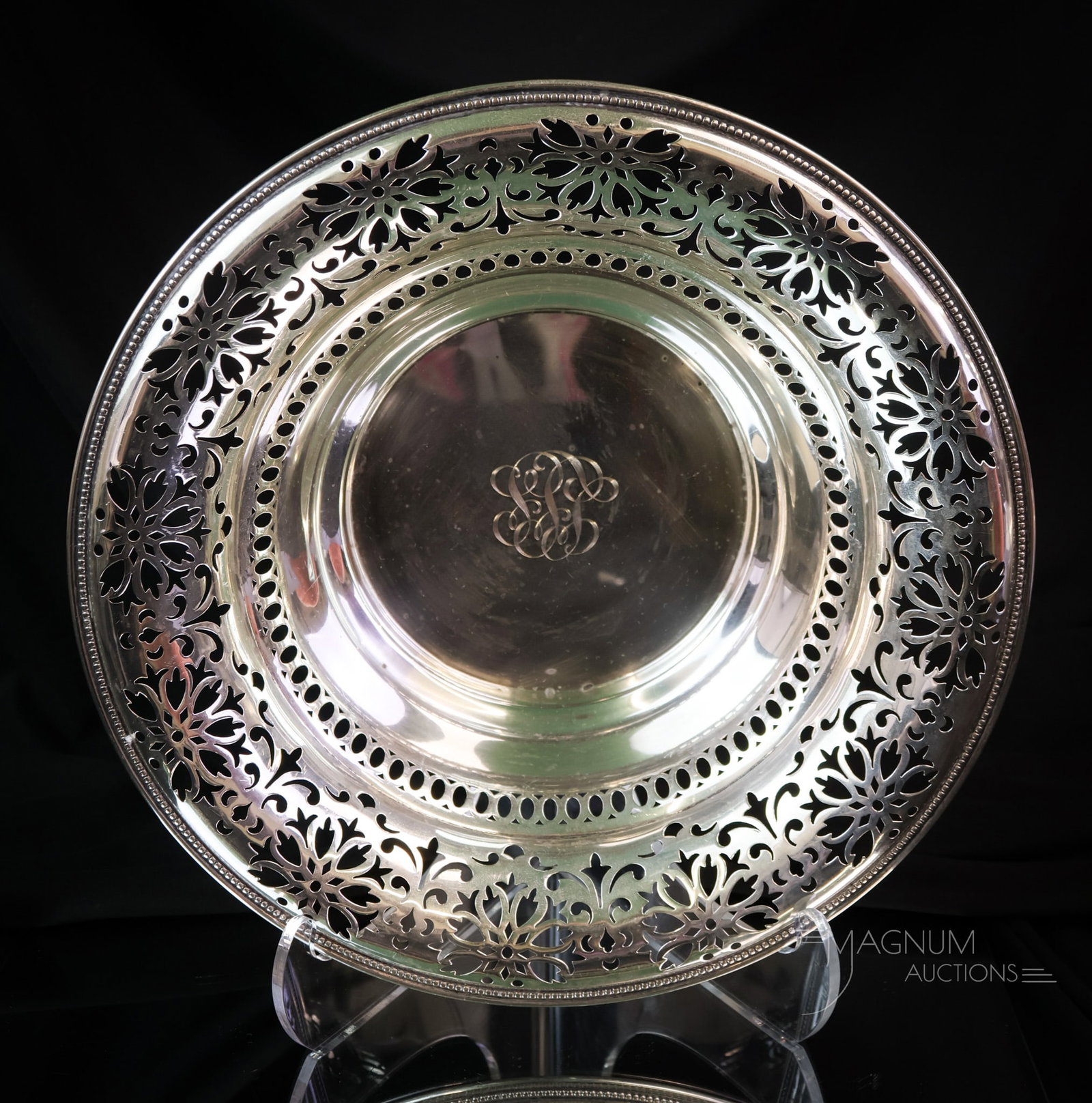 Signed Sterling Silver Pierced 10" Bowl 11.226 OZT: A beautiful piece of pierced sterling silver. This large bowl is monogrammed as well. The bowl weighs 11.226 OZT. The bowl measures 2 3/4" tall and 10" in diameter. SHIPPING NOTICE: If you choose not 