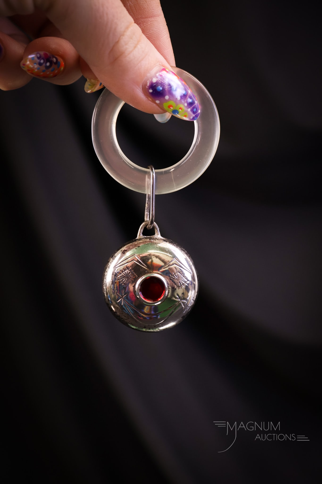 Marked Towle Sterling Silver Clown Baby Rattle & Mother of Pearl Teething Ring: A charming find from yesteryear. This is a marked Towle, sterling silver baby rattle and teething ring. The rattle is in the form of a clown face with a red nose. The teething ring is made of mother-o