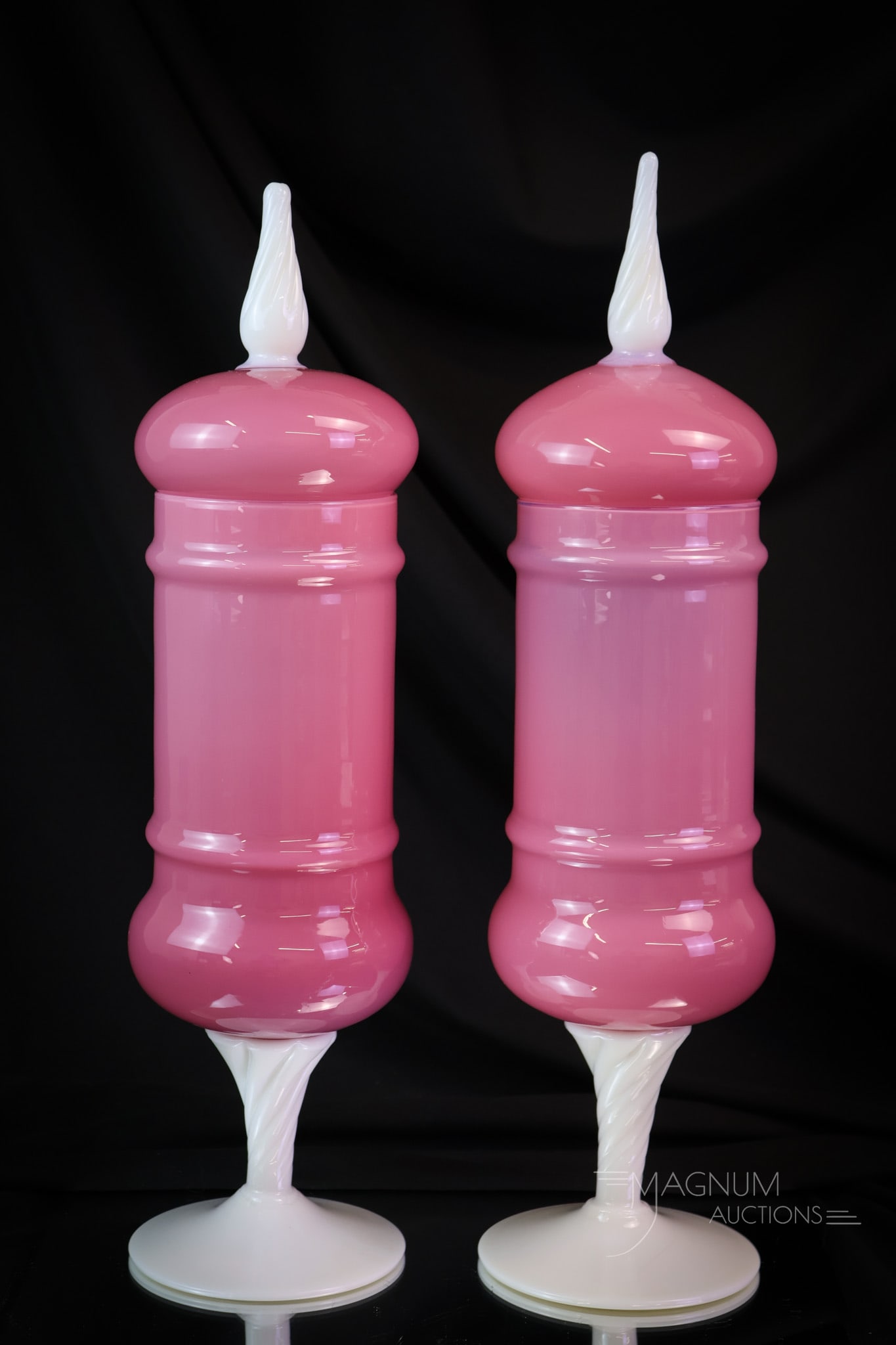 Pair of Italian Pink Opaline Alabaster Glass Pokals: Fine pair of Italian art glass pink opaline and alabaster lidded pokal vessels. Each measures 15 1/2" tall and 3 3/4" wide. SHIPPING NOTICE: If you choose not to utilize the LiveAuctioneers LiveShip p