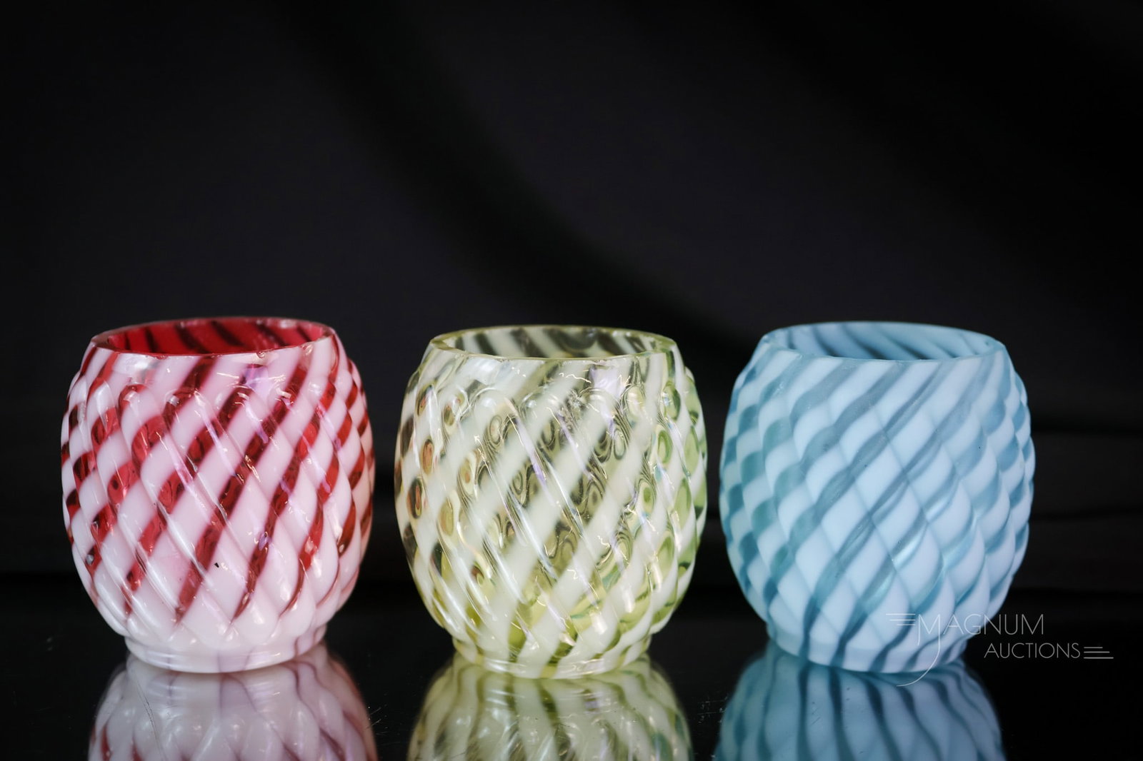 3 pc Lot Victorian Buckeye Glass Reverse Swirl Toothpick Holders Cranberry Blue Uranium Vaseline: Three color ways of the ever-popular Reverse Swirl pattern by Buckeye Glass in the Victorian era. This lot offers a blue, a cranberry, and a glowing uranium-rich vaseline example. Each measures 2" tal