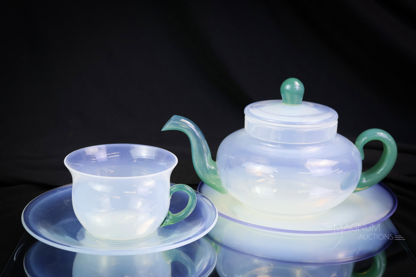 4 pc Lot Fry Foval Glass Green & Blue Teapot & More: A wonderful lot of four items in Fry Foval glass. This lot includes a green teapot, cup, and saucer. There is also a blue Foval plate. The tallest measures 5". SHIPPING NOTICE: If you choose not to ut