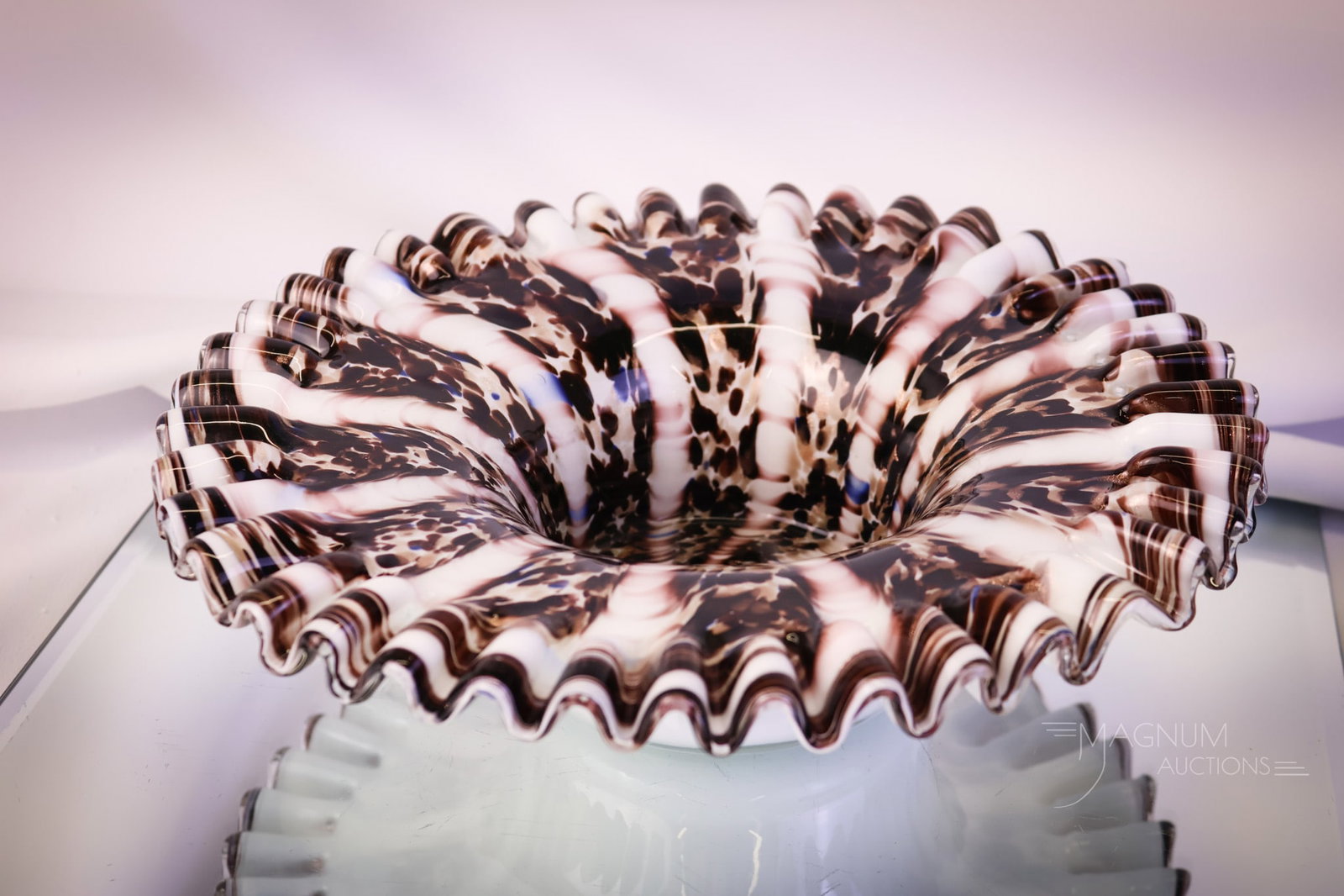 Italian Art Glass MCM Art Glass Tortoise Mica Center Bowl: A gorgeous piece of MCM Italian art glass. This bowl has tortoise coloring with mica inclusions and an almost three-dimensional effect to the pattern. The bowl features a ruffled rim and bright white 