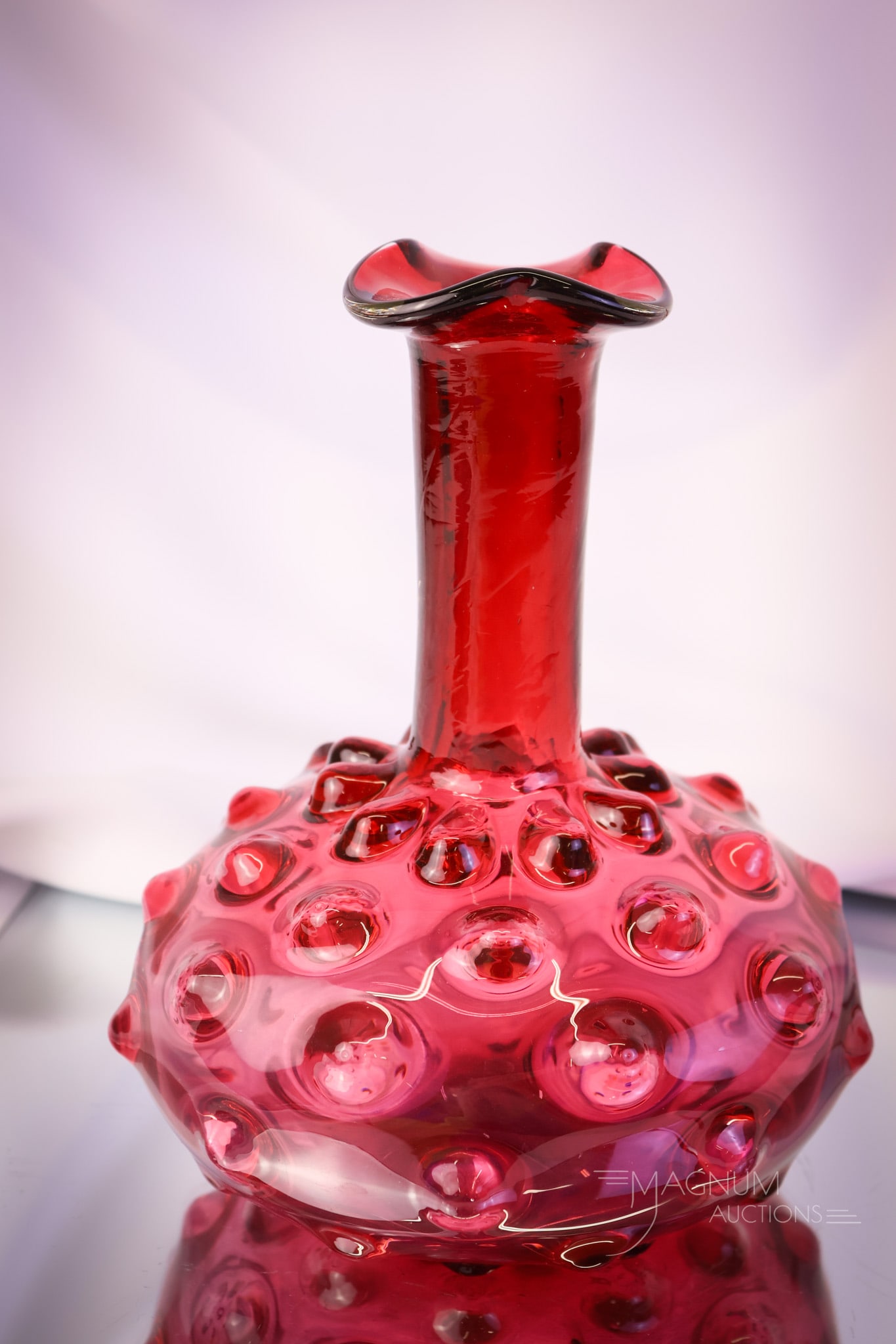 Hobbs Cranberry Bullseye Caraffe Decanter: A wonderful find in a Hobbs Cranberry or ruby glass Bullseye pattern carafe or decanter. This piece has gorgeous coloring and form. A great piece of Victorian glass. The piece measures 7 3/4" tall. SH