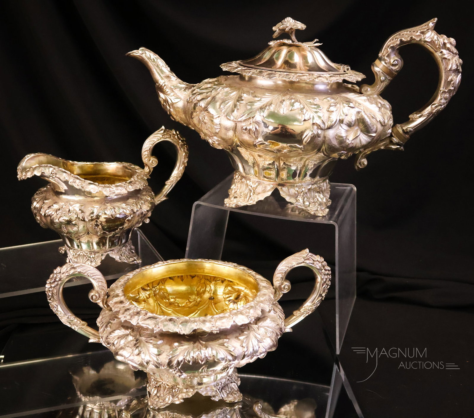 3 pc Antioque Sterling Silver Repousse Tea Set 47.815 OZT: A three-piece antique sterling silver repousse tea set in a floral motif. The set weighs 47.815 OZT. The tallest of the offering is 6 1/2". The widest of the offering is 11 1/2". WIRE TRANSFER OR
