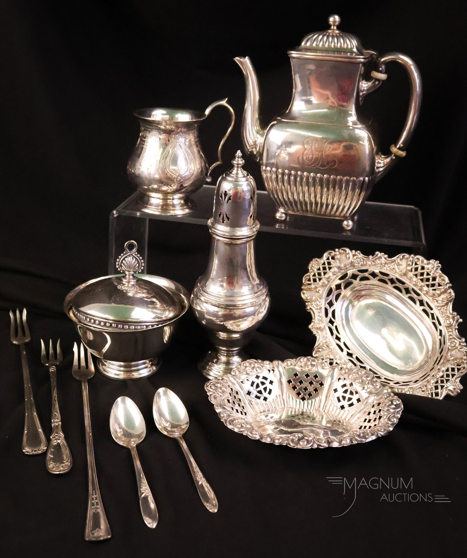 7 pc Lot Silverplate Tiffany & Company and More: A select offering of seven pieces of silverplate items. This lot includes a Tiffany & Co. teapot. The tallest measures 7". The widest measures 5 3/4".