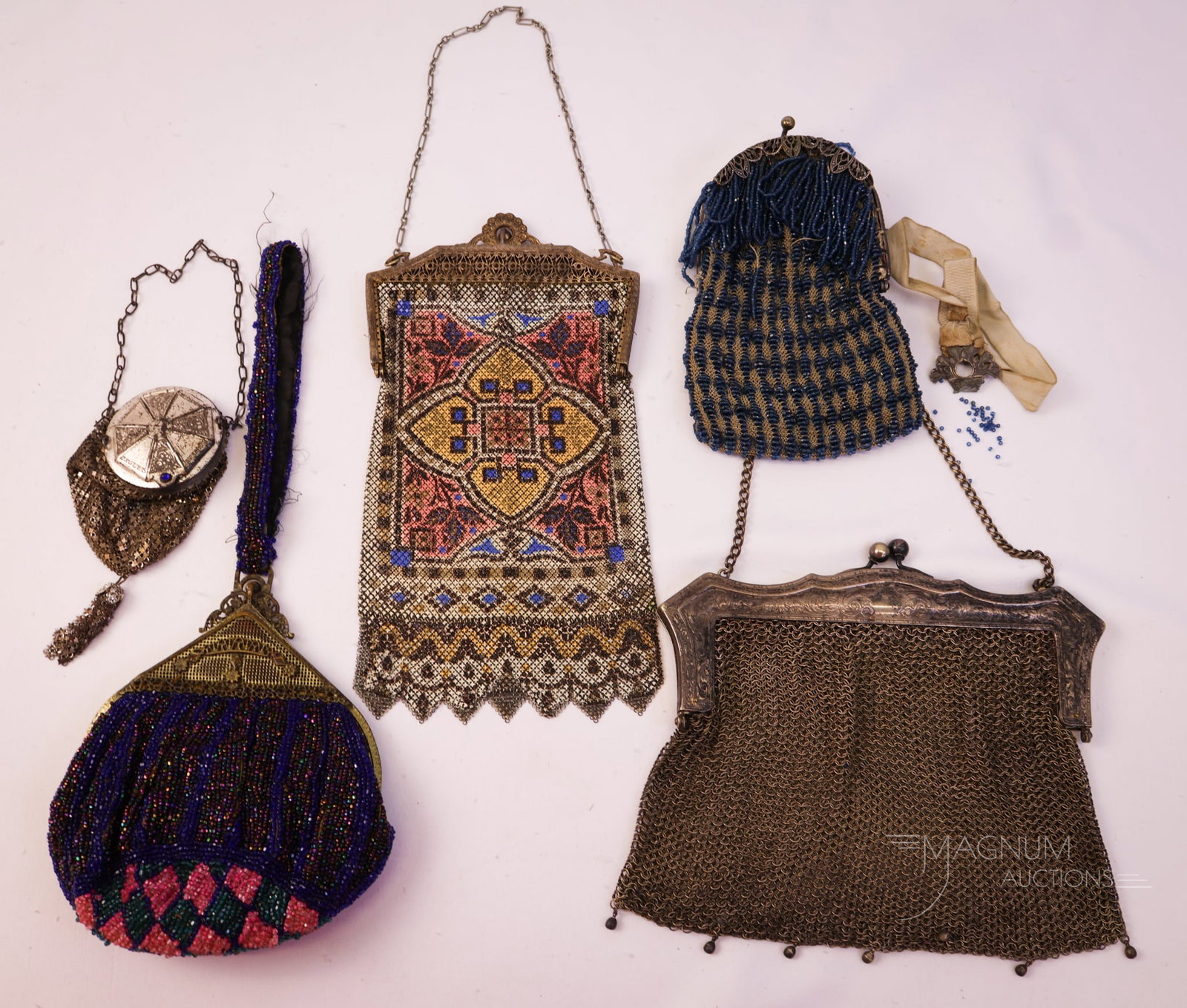 5 pc Lot Antique Ladies' Purses Beaded Mesh & German Silver: Here is a five-piece lot of antique ladies' purses. This lot includes two beaded and three mesh examples. One is mandalin with a geometric design and a jeweled frame. The second is a German silver. Th