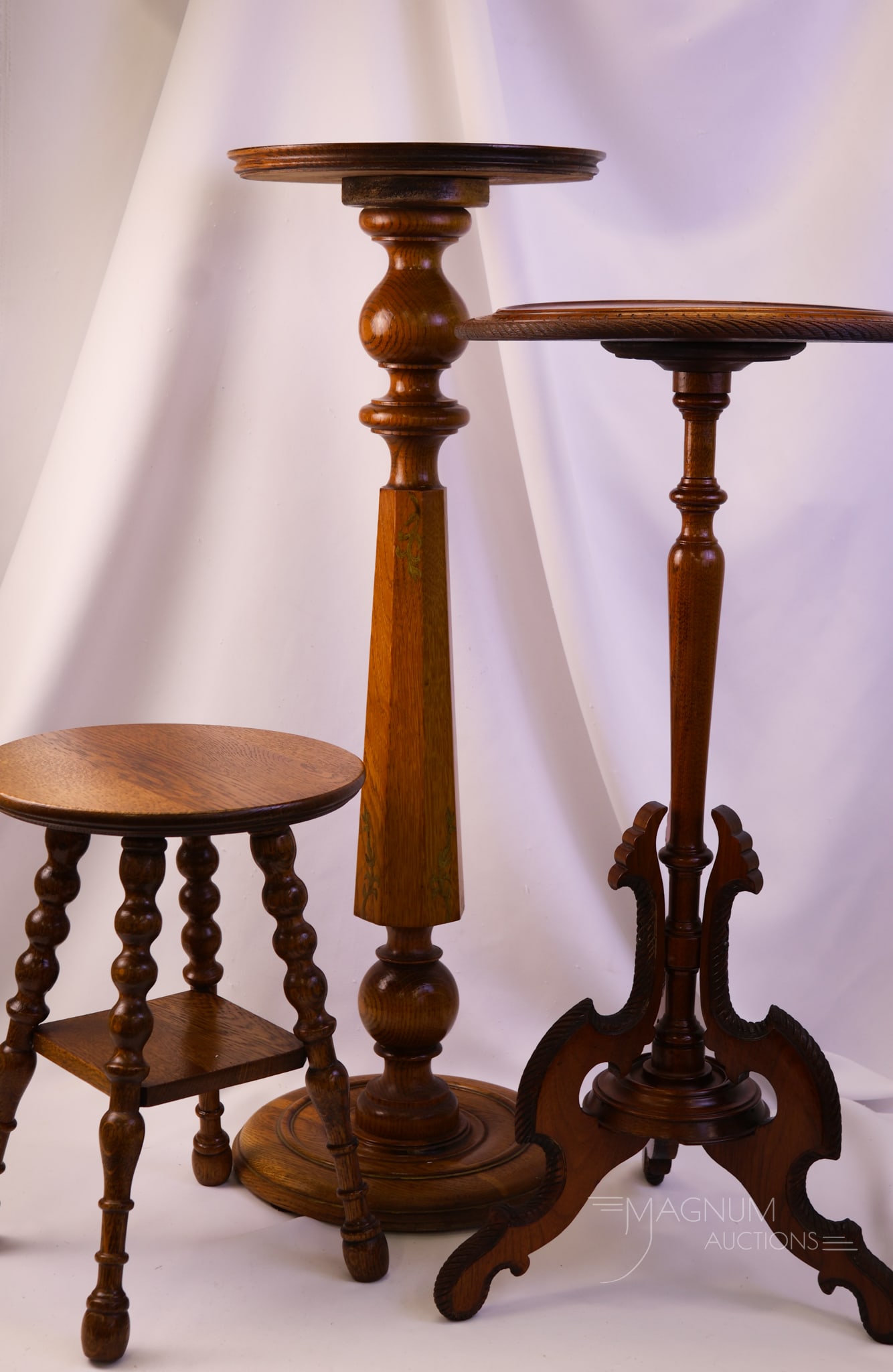 3 pc Lot Victorian Wood Pedestal Stands: Three graduated sizes of Victorian wood pedestal stands. The tallest measures 34 1/2" tall and 14" wide.