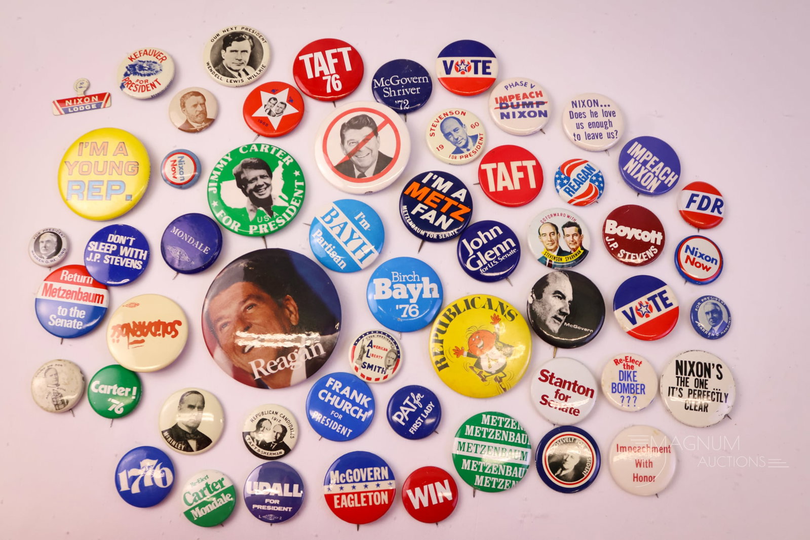 54 pc Lot Vintage Political Buttons: A large lot of 54 Political collectible pin buttons. These examples include Carter, Reagan, Nixon, and more. The largest is 3" in diameter.