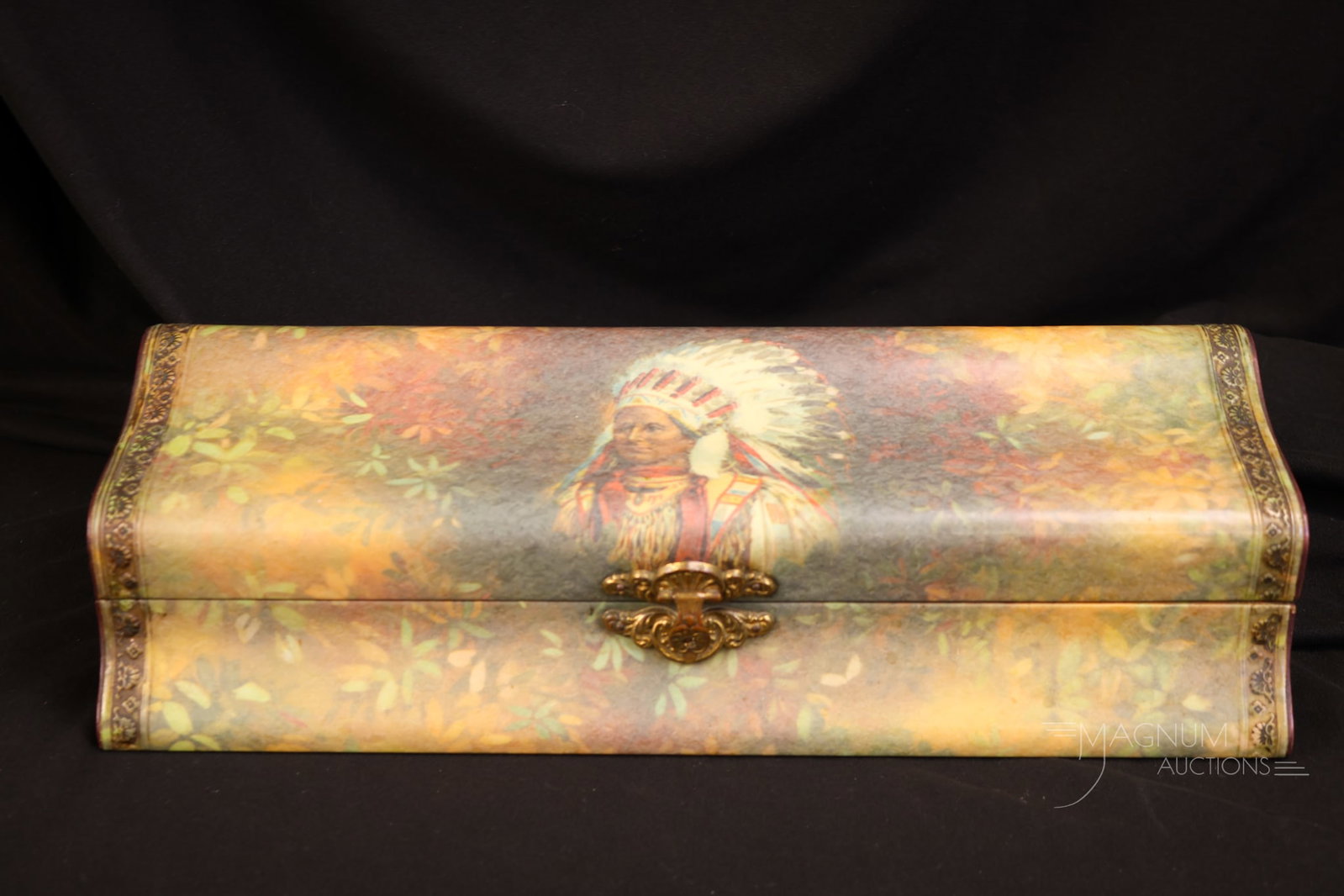 Antique 13" Victorian Celluloid Glove Box with Indian Chief: A wonderful and unusual find in a Victorian Celluloid glove box. This piece features a decoration of an Indian chief on the lid. The box measures 3" tall and 13" wide.