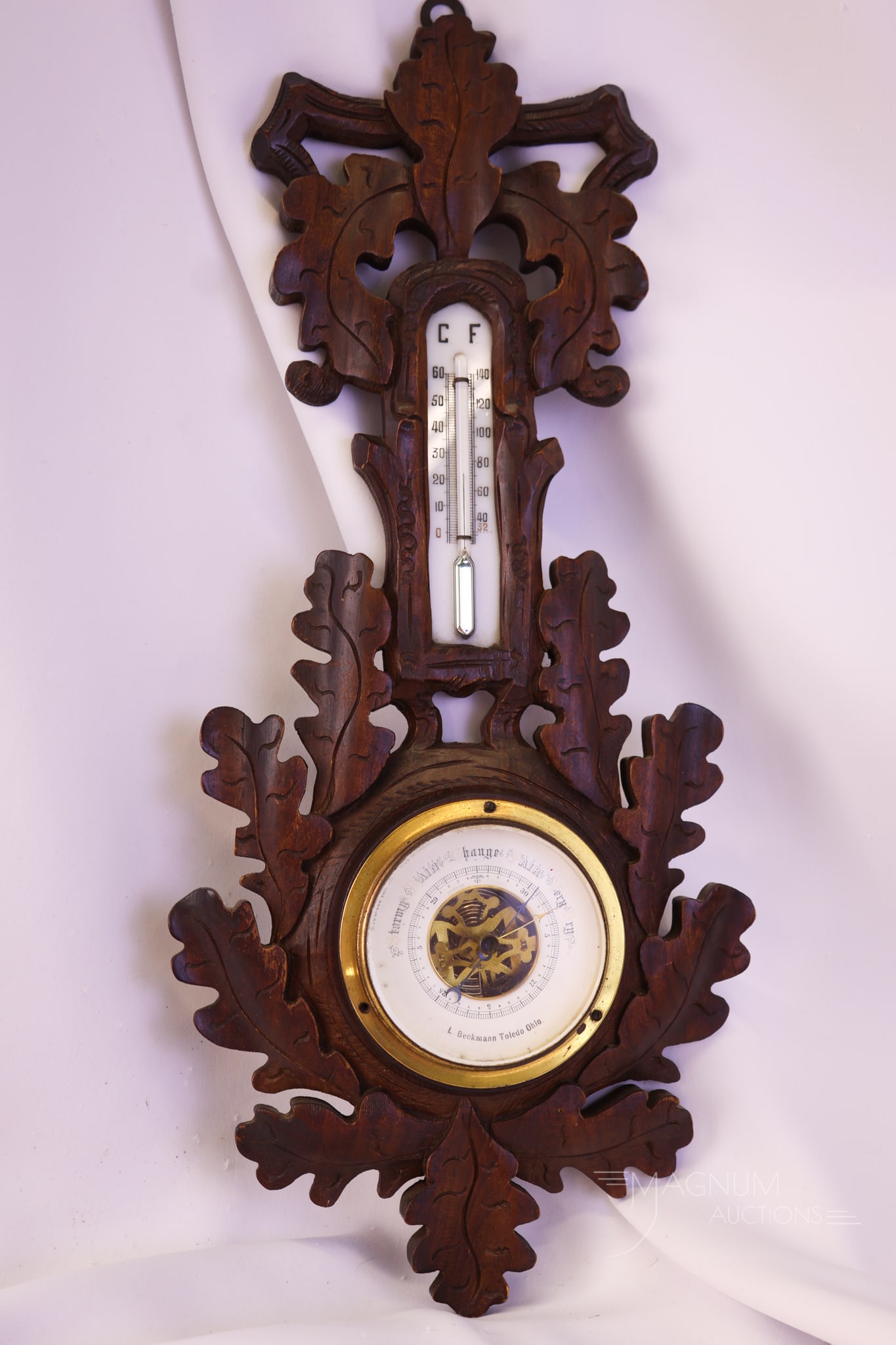 Black Forest Victorian Thermometer by "L. Beckmann, Toledo, OH.": A beautiful find in a black forest carved Victorian thermometer. This piece is made by and marked, "L. Beckmann, Toldeo, OH." The piece measures 18 1/2" tall and 8" wide. Minor losses to the carvings