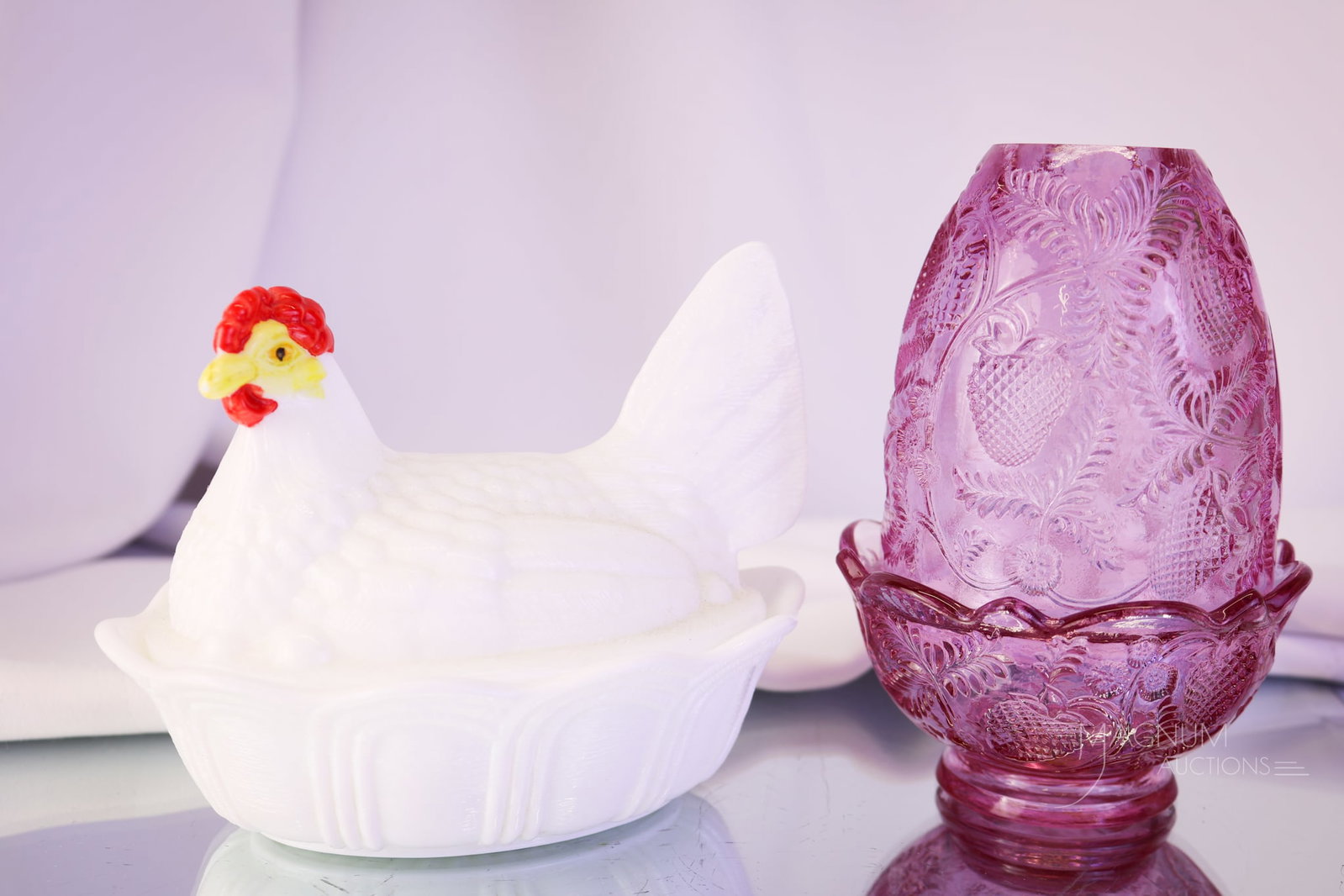 2 pc Lot Fenton Art Glass Fairy Lamp & Hen on Nest: Two collection-enhancing pieces to bid on in this auction. This lot offers a Dusty Rose Inverted Strawberry fairy lamp along with a milk glass with a painted-face hen on a nest. The largest measures 5