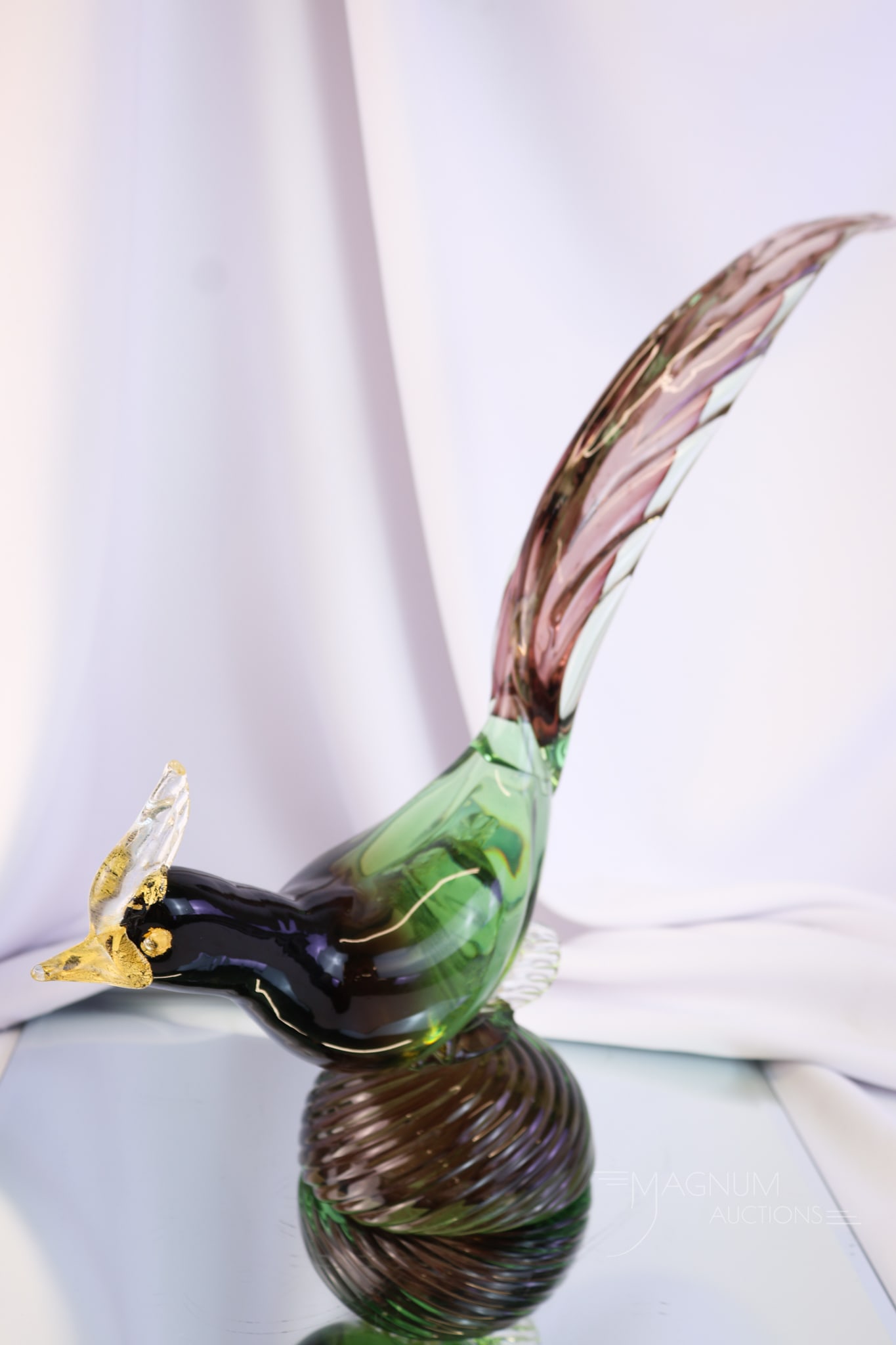 Murano Glass 14 1/2" Pheasant Sculpture Uranium: A large and glowing 14 1/2" tall Italian Murano glass sculpture of a pheasant. This glass is rich in uranium content and glows under black light. It is in colors of green and amethyst with gold