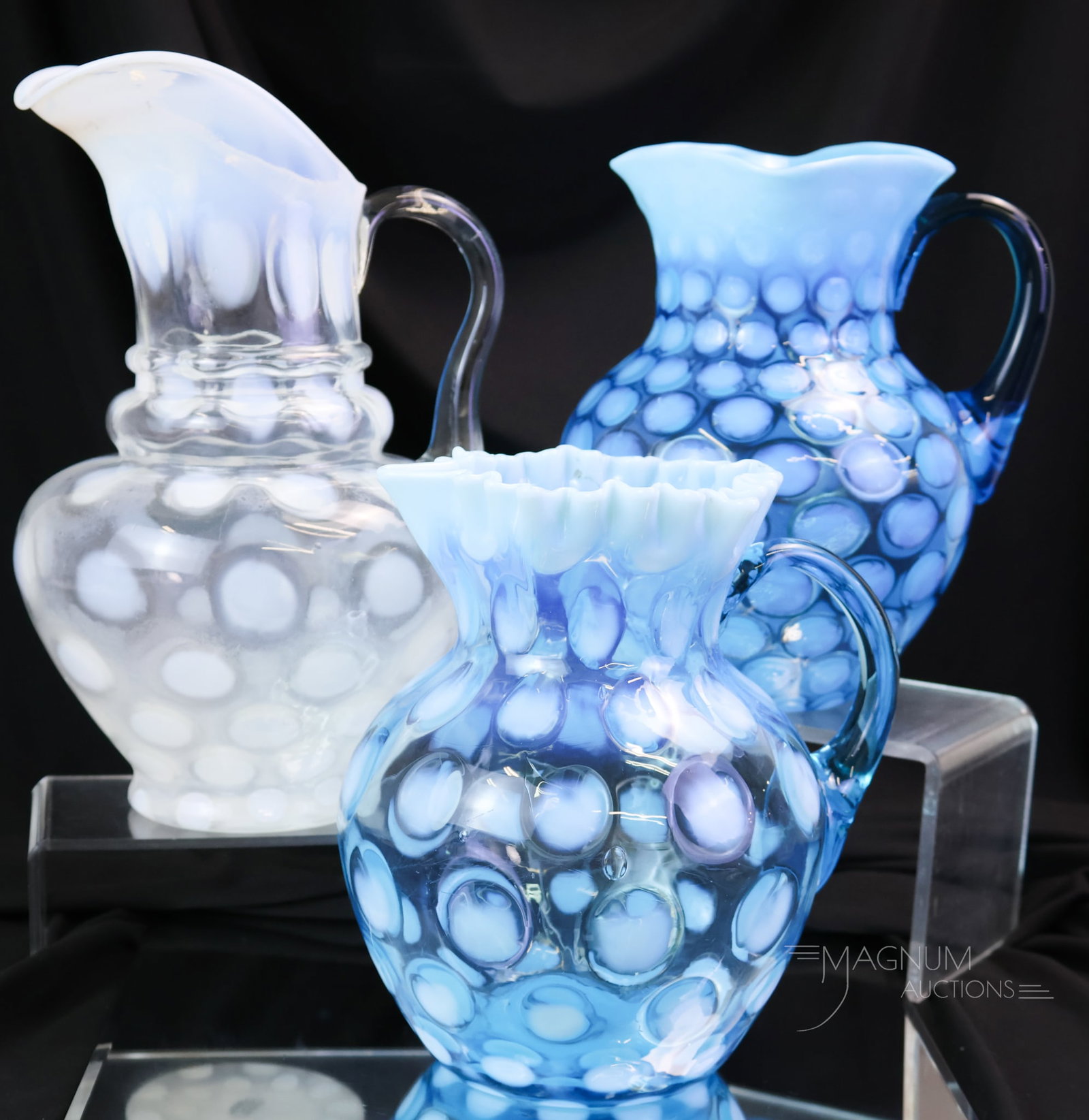 3 pc Lot Victorian Opalescent Glass Water Pitchers: Three striking finds in opalescent Victorian glass water pitchers. All of the pitchers exhibit bright opal. The tallest measures 11". The three-tier example exhibits cloudiness to the glass.