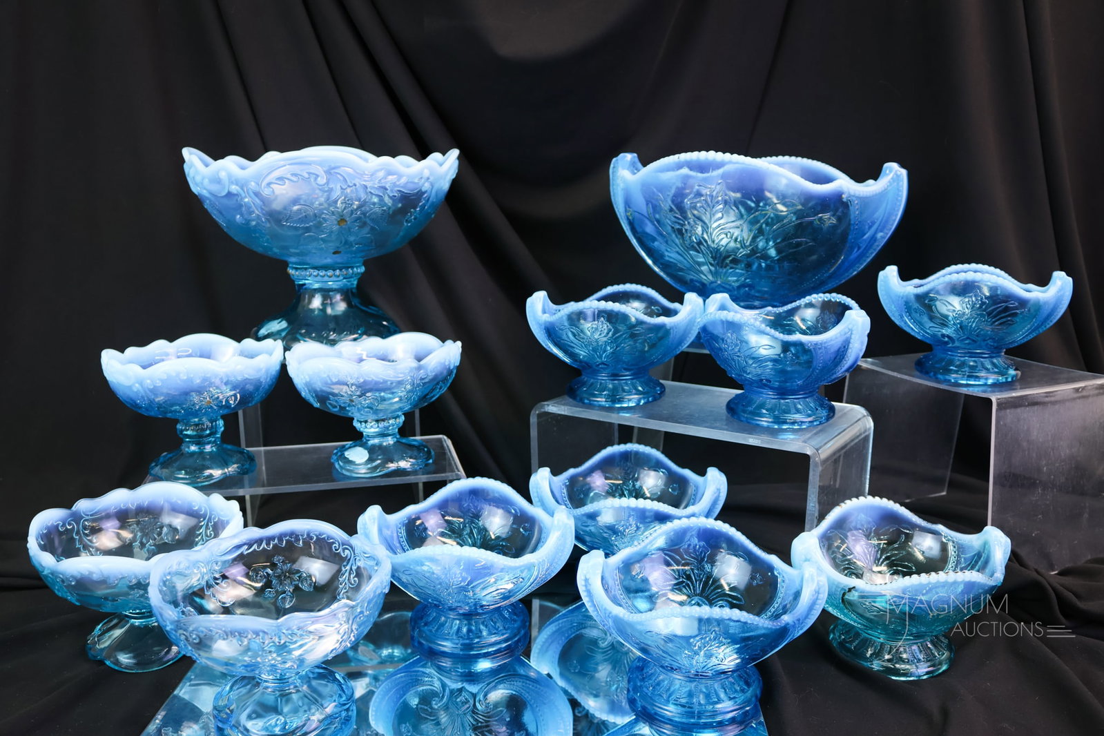 12 pc Lot Blue Opalescent Victorian Northwood Glass Wild Bouquet & Intaglio: A generous offering of blue opalescent Northwood Victorian glass. This lot includes a five-piece Intaglio pattern berry set along with a seven-piece Wild Bouquet berry set. The tallest of the