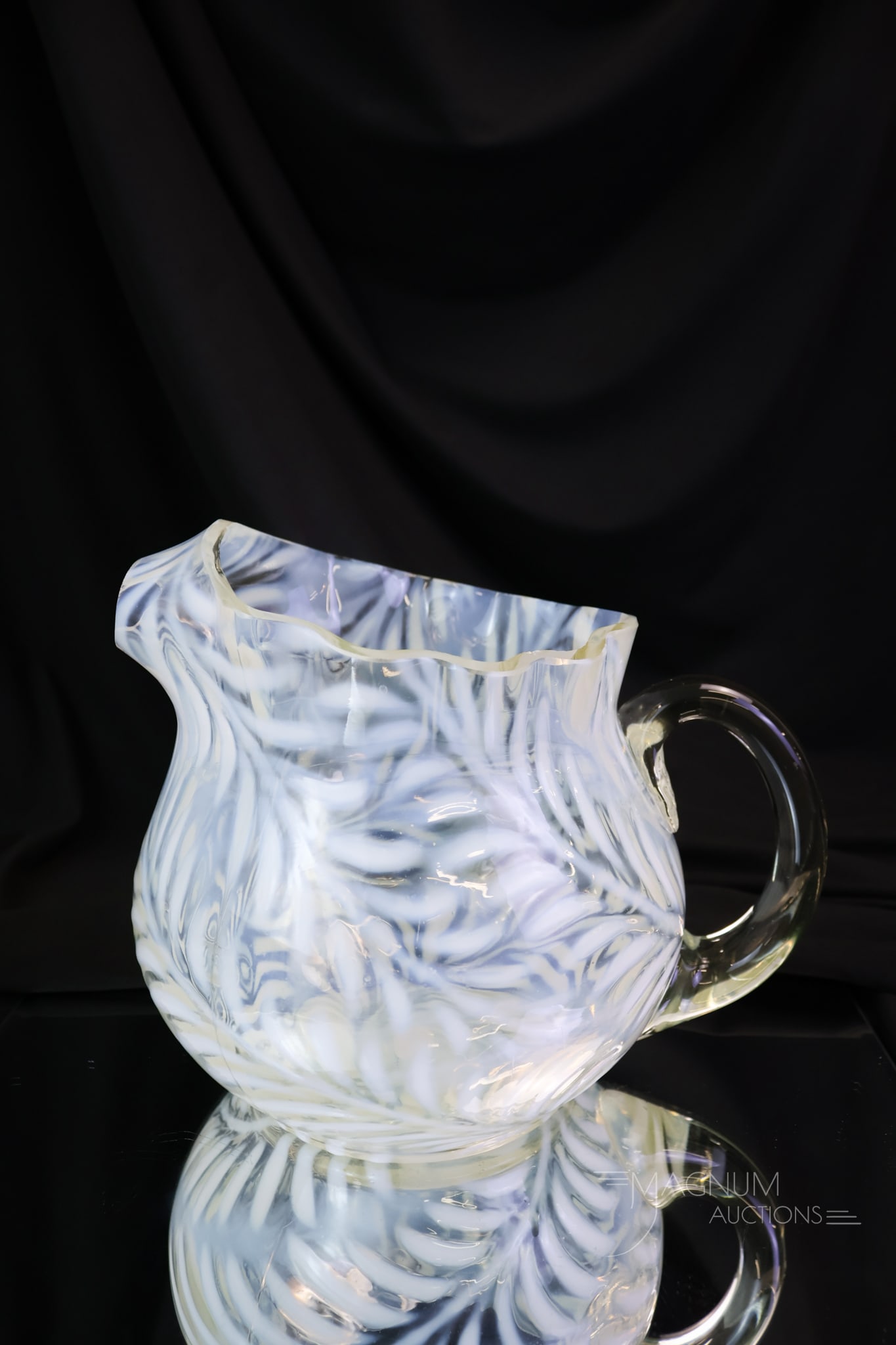 West Virginia Opalescent Fern Victorian Glass Water Pitcher: A rare find in a Victorian opalescent fern water pitcher. This pitcher has the rare ice spout. The nice opal and rarity make this a must-have find for your collection. The pitcher measures 6 1/4"