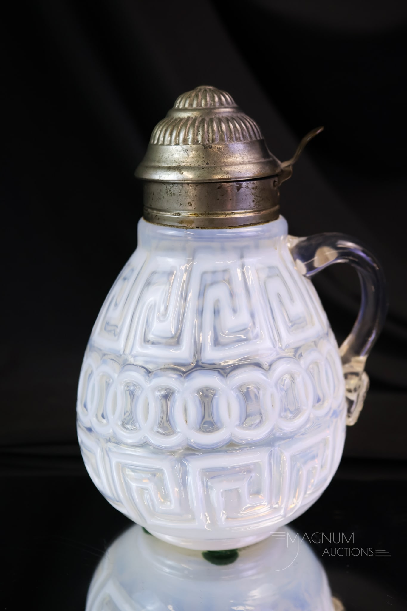 Rare Fostoria Nickel Plate Double Greek Key Victorian Glass Syrup Pitcher: A rare find in a Fostoria Nickel Plate opalescent Double Greek Key pattern syrup pitcher. Seldom of these around, we dare say. The syrup has bright white opal and great pattern. The syrup measures 6"