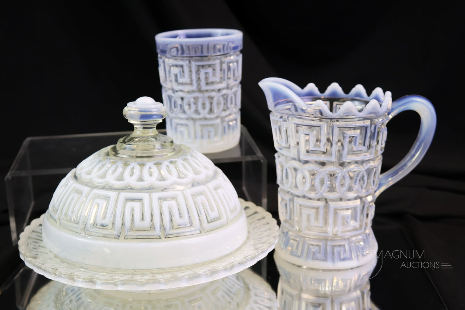 3 pc Fostoria Nickel Plate Double Greek Key Opalescent Glass: Three seldom-found pieces of Fostoria Nickel Plate Double Greek Key pattern opalescent glass. This lot includes a butterdish, a creamer, and a tumbler. The butter lid flange and inner rim of the base