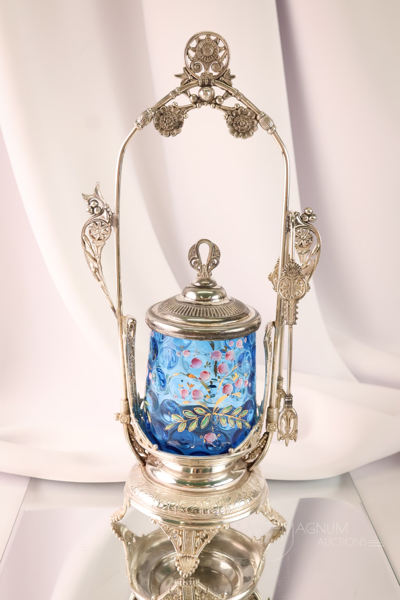 Derby Silverplate Blue Enamel Decorated Glass Pickle Castor: A wonderful and showy Victorian blue enamel-decorated silverplate and glass pickle castor. This superb example measures a whopping 15 1/2" tall. If you like 'em big, this one's fit for a size queen.