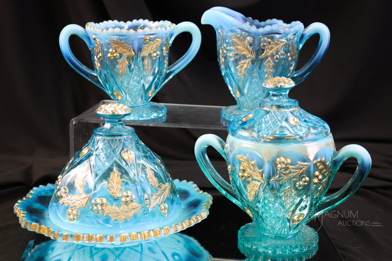 4 pc Northwood Blue Opalescent Panelled Holly Table Set: A beautiful offering made by Northwood. This is a four-piece table set in the Panelled Holly pattern. This set is embellished with gilt decoration. Lovely! The tallest of the set measures 6 1/2". The 