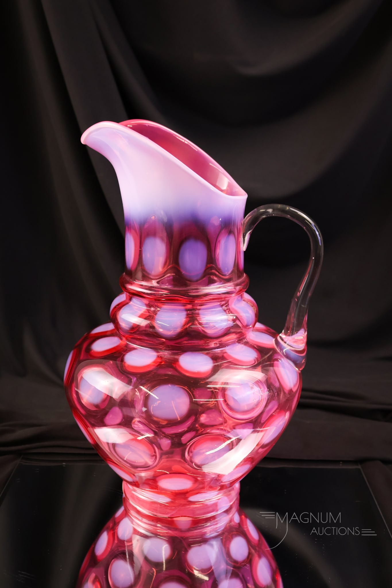 Northwood Cranberry Opalescent 3-Tier Coinspot Victorian Glass Pitcher: A beautiful example of a Northwood 3-Tier cranberry opalescent water pitcher. This one has deep, rich color and bright opal. The pitcher measures 11" tall.