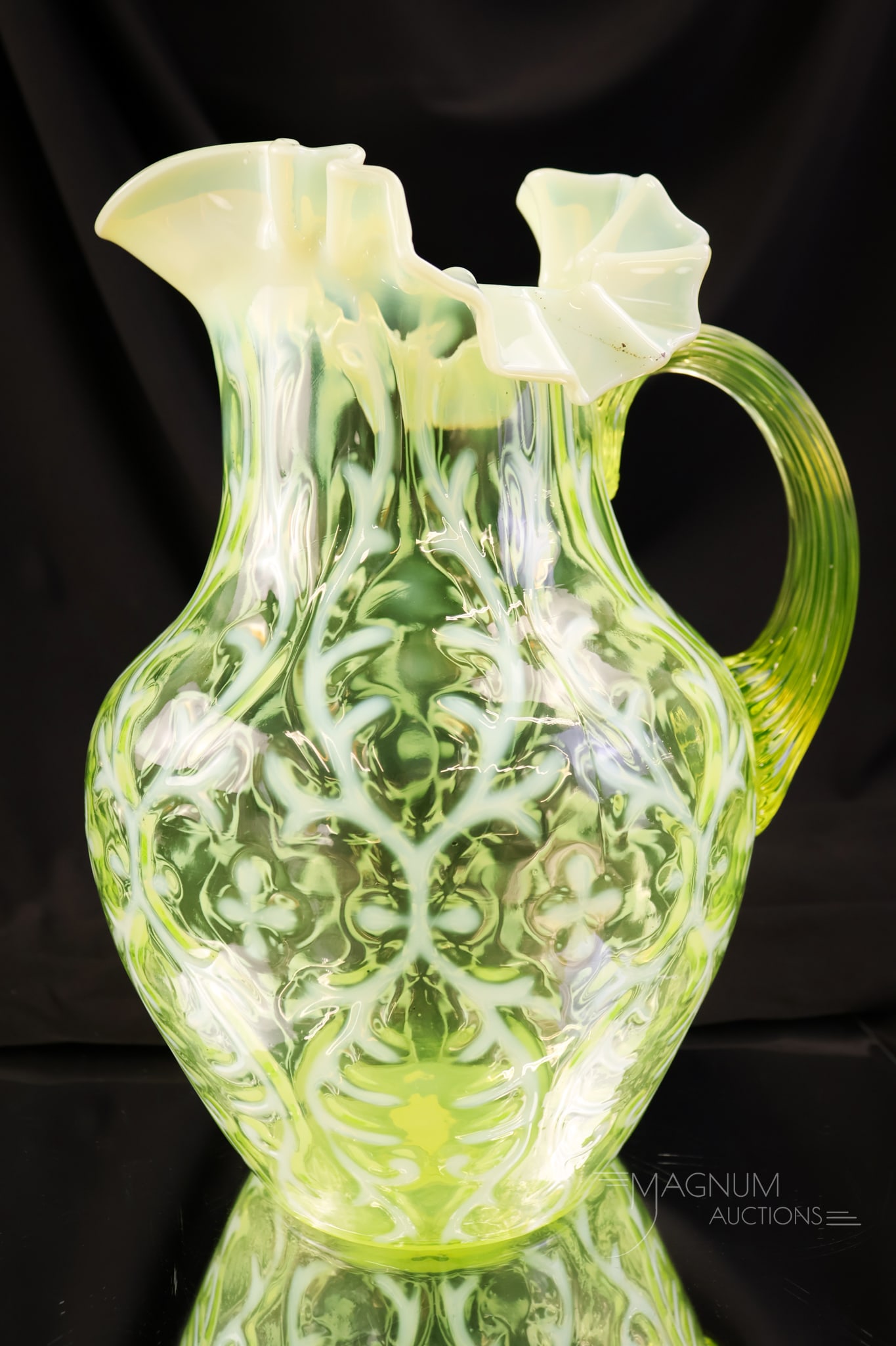 Northwood Vaseline Opalescent Uranium Spanish Lace Victorian Glass Water Pitcher: A shining find for your collection. This is a Northwood vaseline opalescent uranium-rich glass water pitcher. This piece has bright white opal and excellent coloring. The pitcher measures 9 3/4" tall.