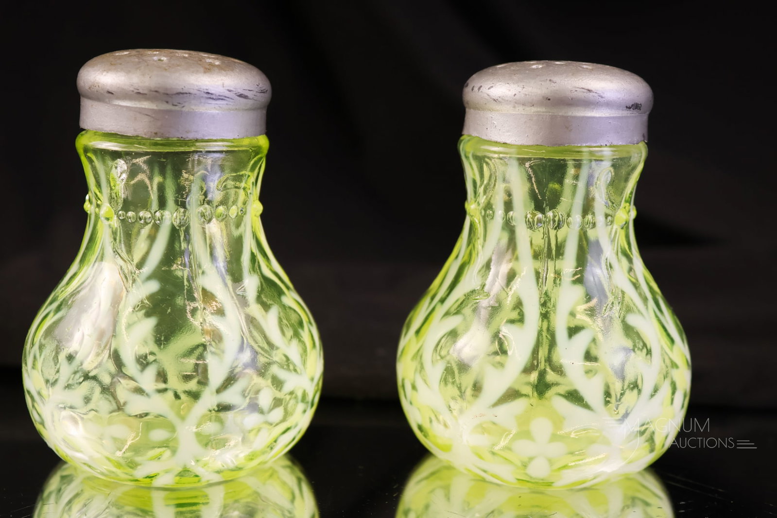 Pair Northwood Vaseline Opalescent Uranium Spanish Lace Victorian Glass Salt Shakers: A brilliant vaseline uranium-rich pair of Victorian glass salt shakers. This pair is in the Northwood Spanish Lace pattern. Each glows brightly under black light due to the uranium content. Each shake
