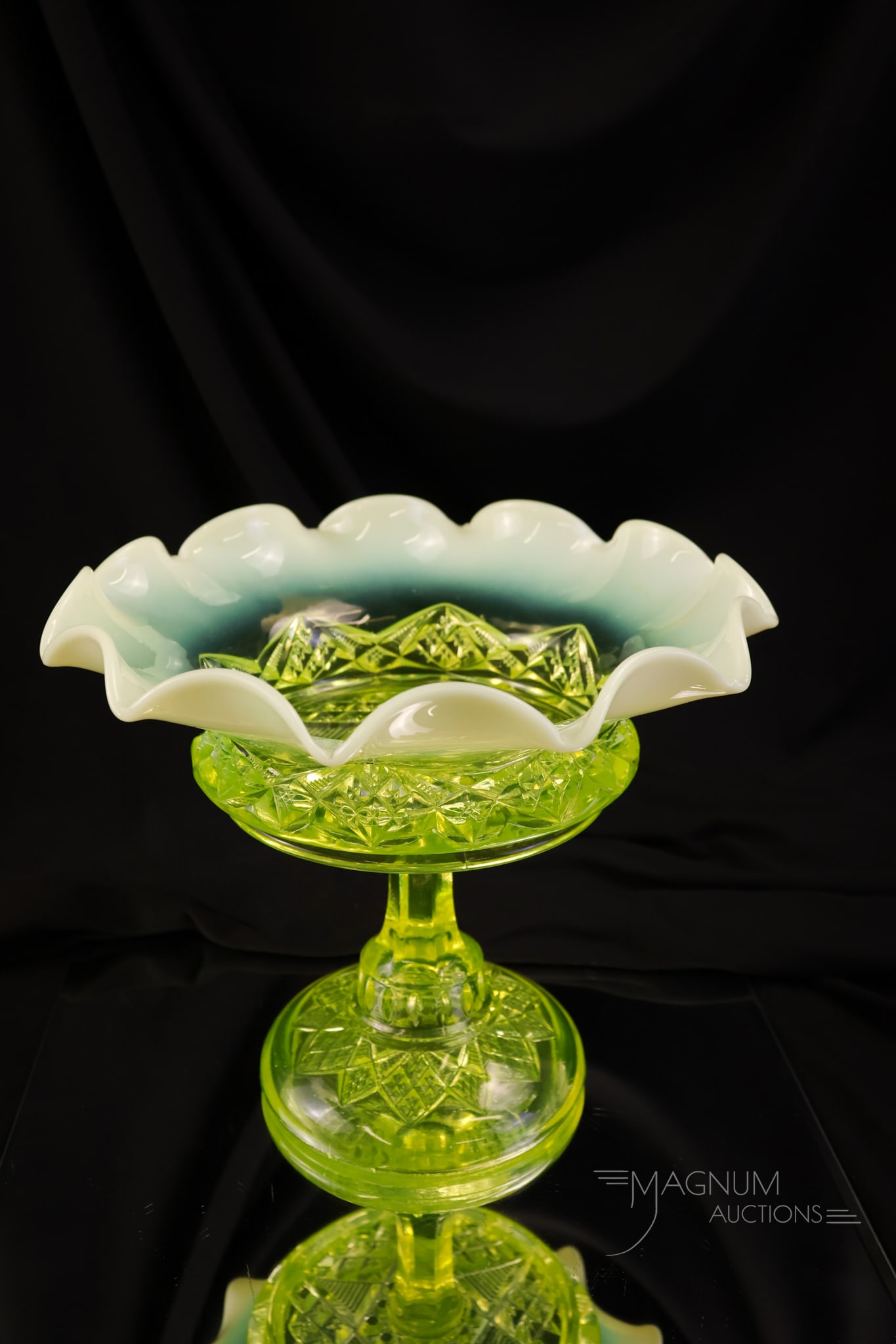 Rare Northwood National Vaseline Opalescent Uranium Opalescent Glass Compote: A rare find in Victorian Northwood/National Glass in the Diamond Spearhead pattern. This compote glows brightly under black light with its uranium-rich glass. This piece stands 8" tall and is 9 1/4" w