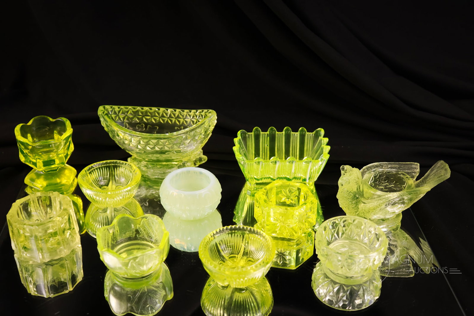 11 pc Lot Vaseline Victorian & More Uranium Glass Salt Dips: A seductive lot of alluring glowing vaseline glass for your bidding pleasure. This lot offers eleven salt dips ranging from the Victorian era to Contemporary examples. The tallest measures 2". The Wil