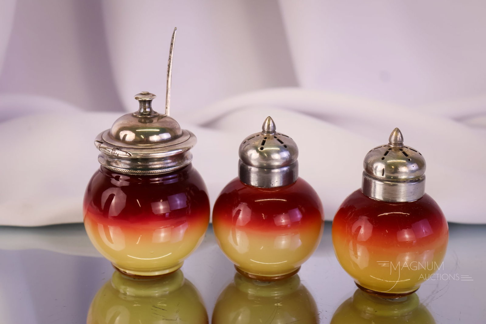 3 pc Lot Wheeling Peachblow Salt Shakers & Mustard Jar Uranium: A select offering of two Victorian Wheeling peachblow salt shakers accompanied by a single mustard jar. This trio has perfect coloring, and yes, they do glow under black light with the uranium