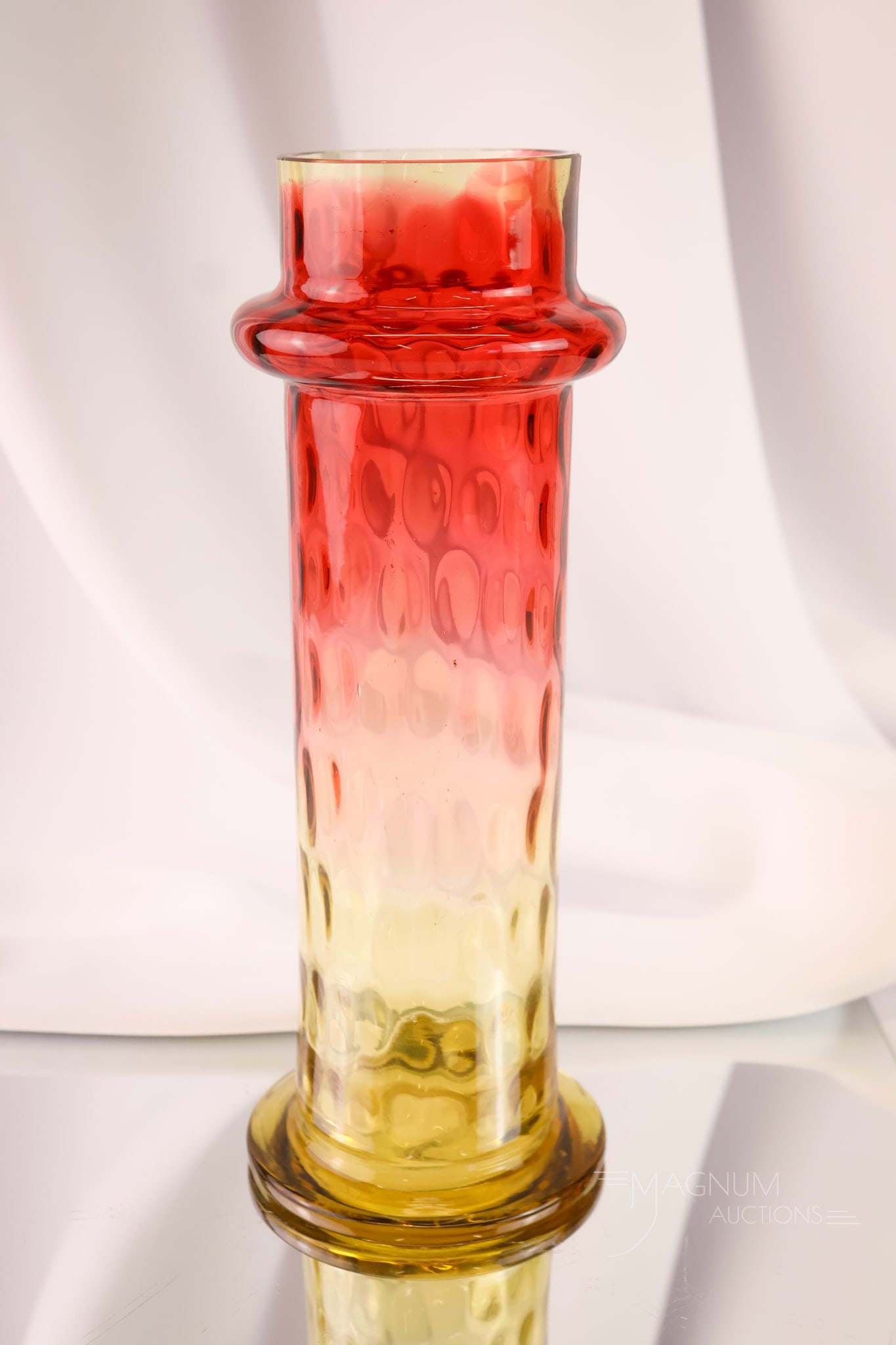 Victorian Amberina Glass Straw Jar Base: A lovely find in Victorian glass. This is an amberina inverted Thumbprint pattern straw jar. This piece has great coloring. The straw jar base measures 10 3/4" tall.