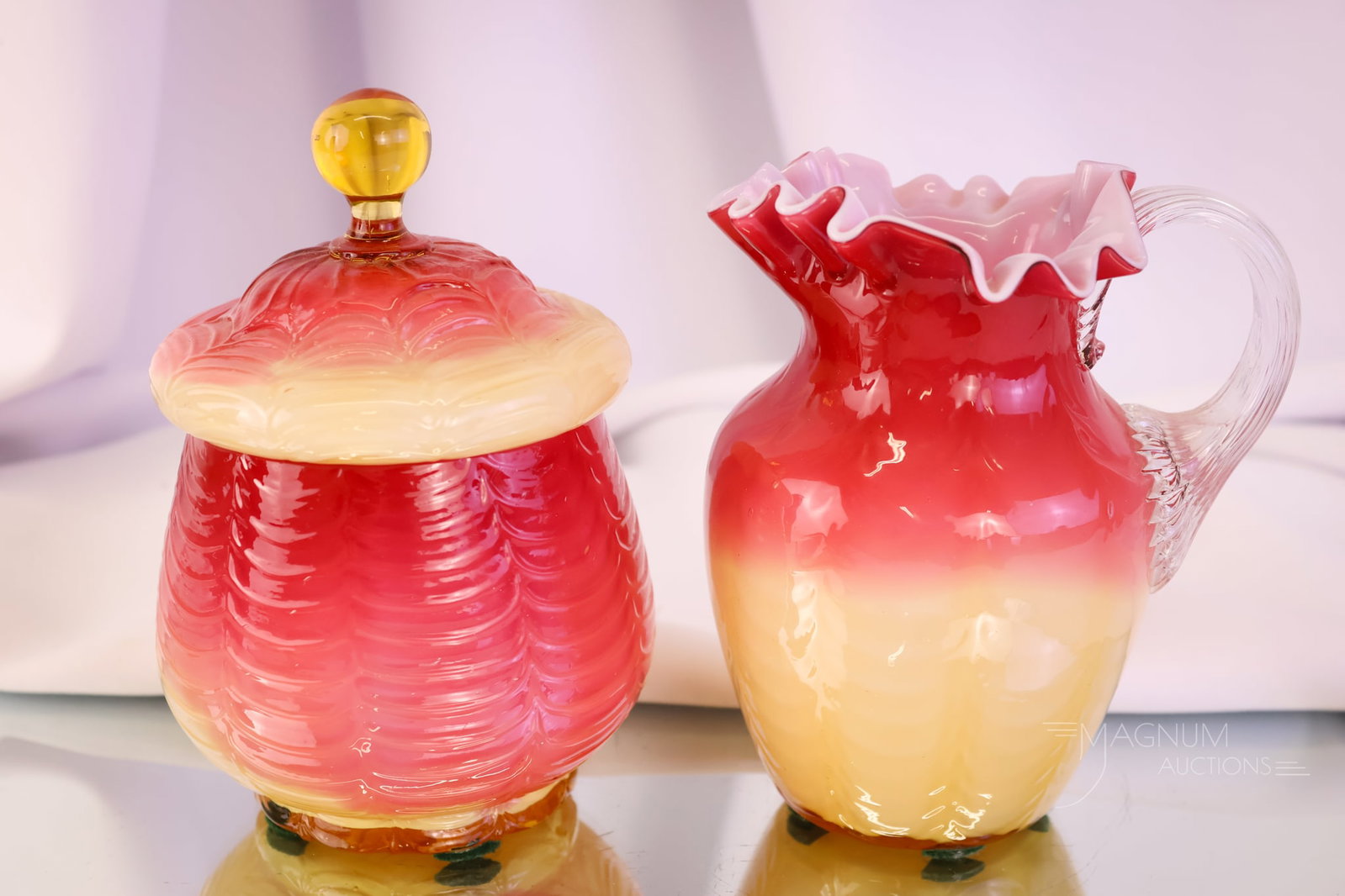 2 pc Lot Phoenix Victorian Amberina Cased Drape Creamer & Sugar Bowl: A fine pairing of two pieces of Victorian Phoenix cased amberina drape glass. This is a breakfast set that includes a cream pitcher and a covered sugar bowl. The set has perfect coloring. The tallest 